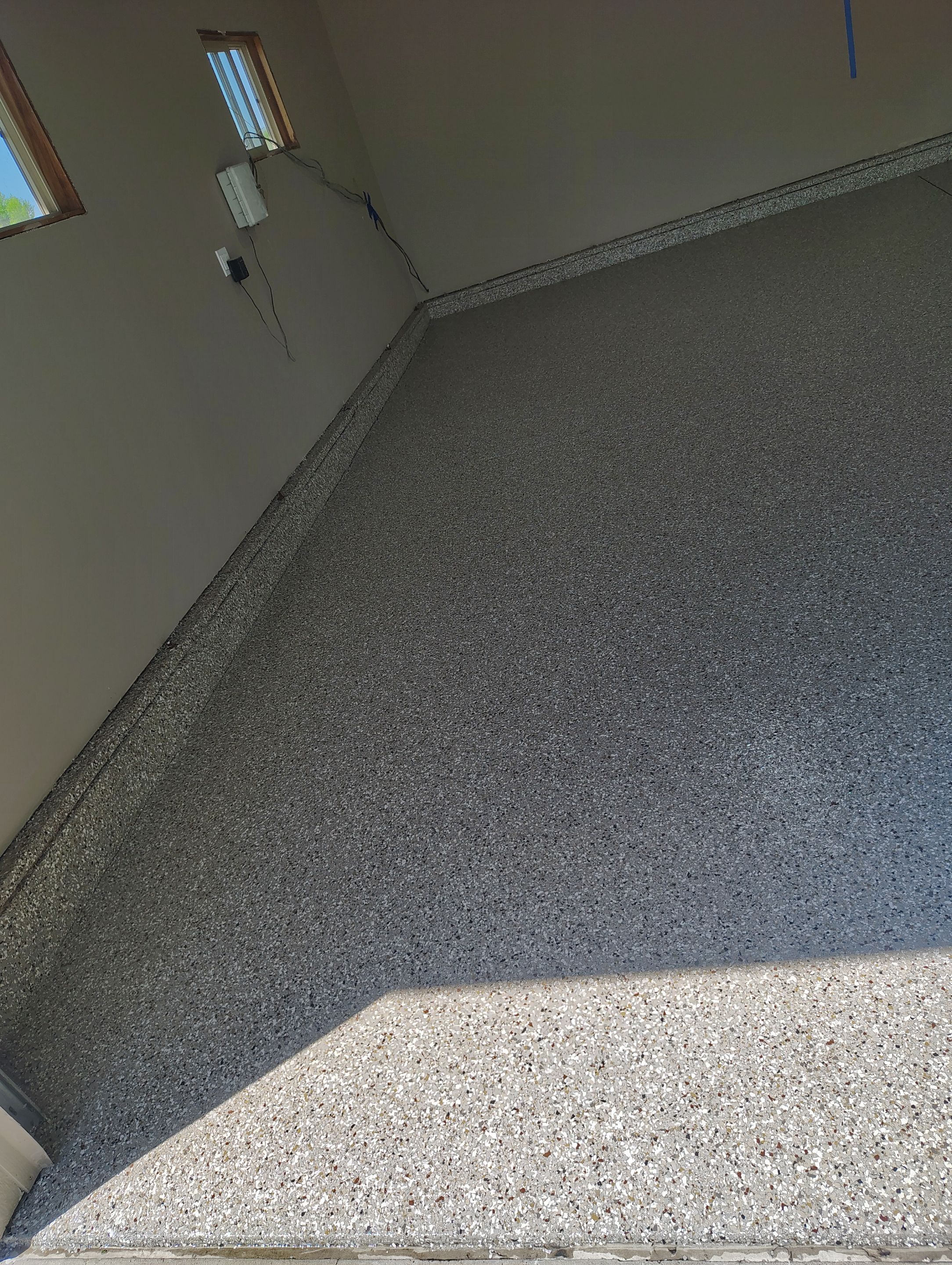 Sioux Falls Garage Concrete Repair and Epoxy Flake Floor Coating by Select Painting, Coatings & Garage Cabinets