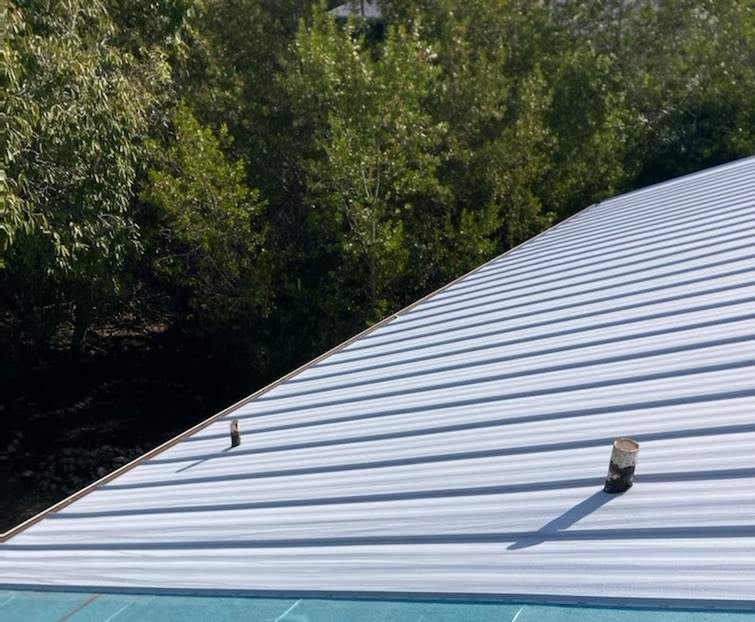 Residential Roofing Installation using Gulf Coast Metals Gulf Seam Panels by Four Peaks Roofing