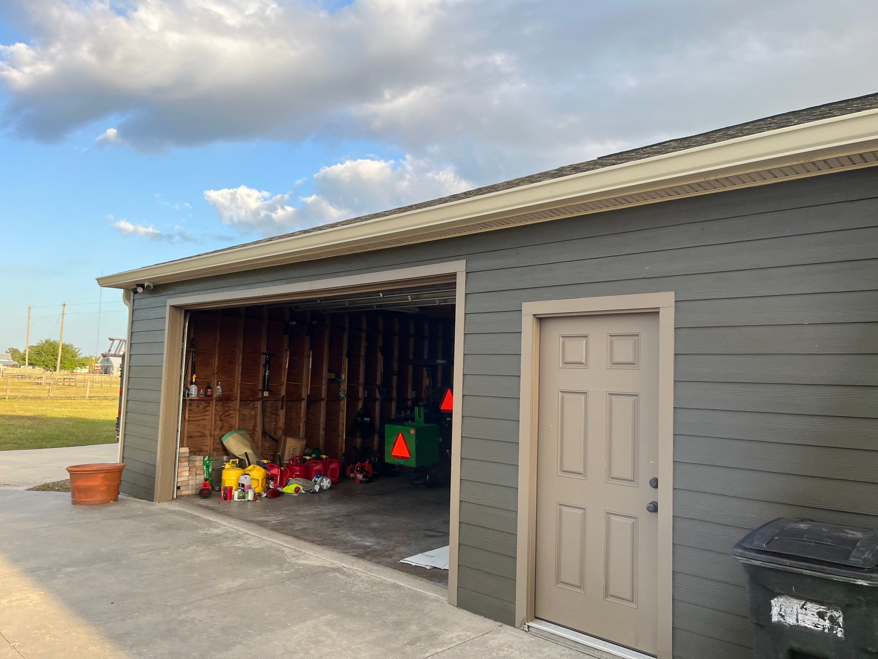 7-inch White seamless gutters and downspouts in Myakka City FL by Gutter Professors