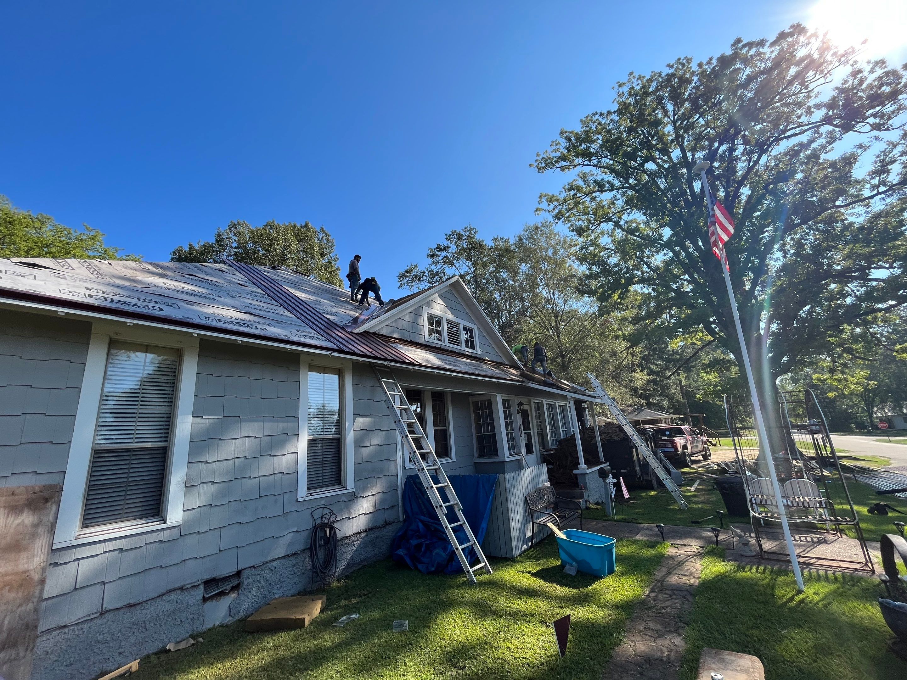 Residential Metal Roof Replacement using Reed's Metals: Colored Residental Panel (Burgundy) by Hostetler Roofing