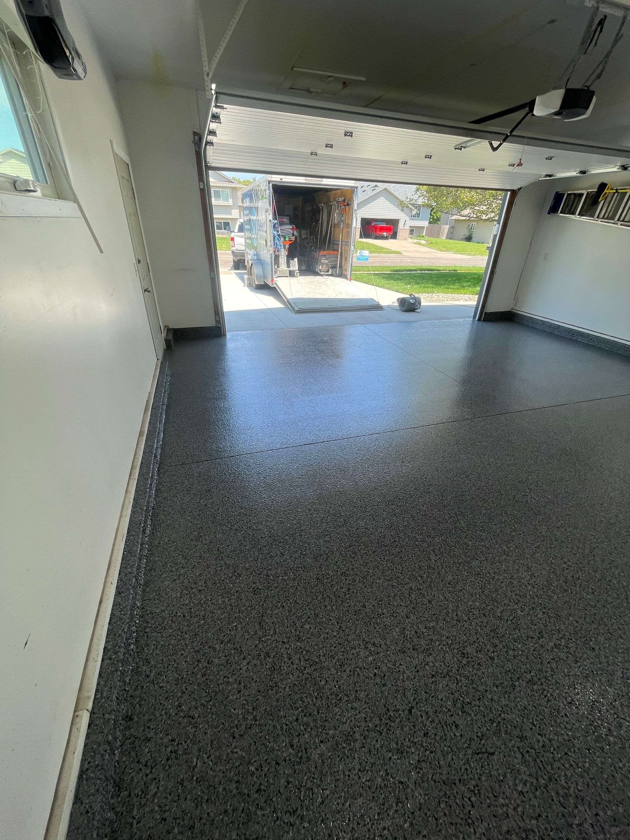 Sioux Falls Garage Floor Coating with Nightfall Decorative Chips by Select Painting, Coatings & Garage Cabinets