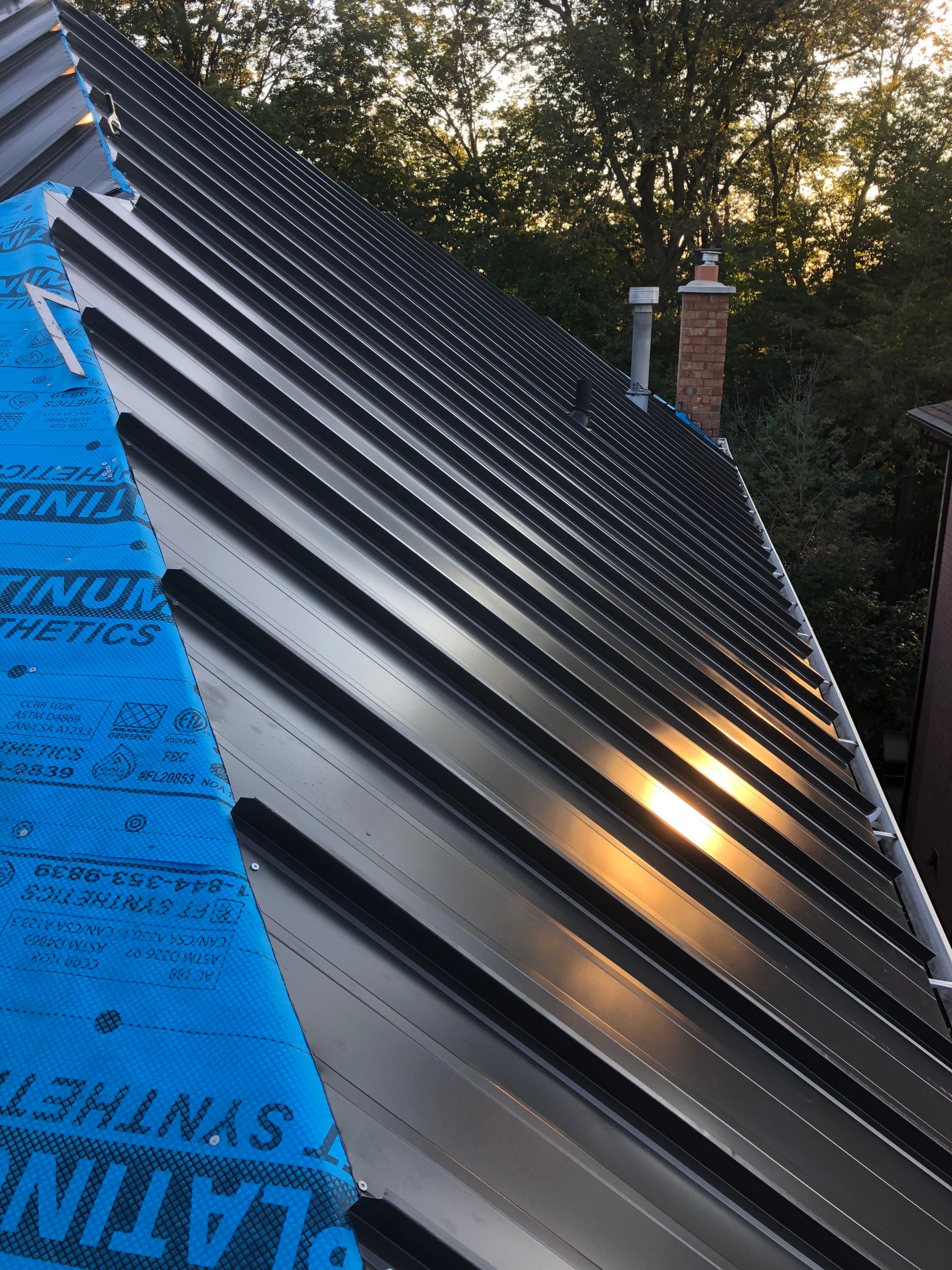 Residential Roofing Installation using 16" Standing Seam Panels by Jay Carter Roofing & Sheet Metal