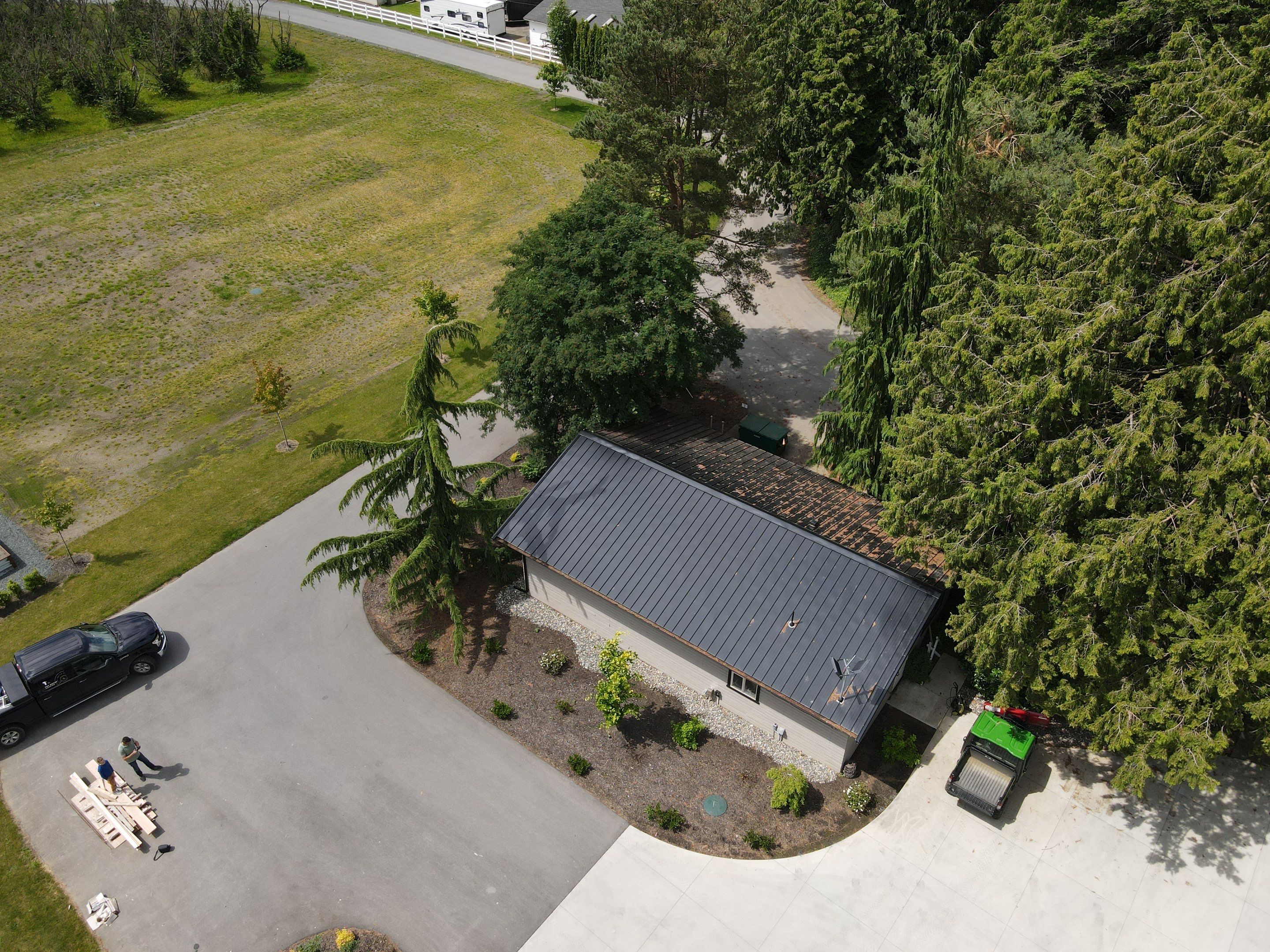 Commercial Roofing Installation using 12" Prolok metal  by Top Notch Roofing Inc