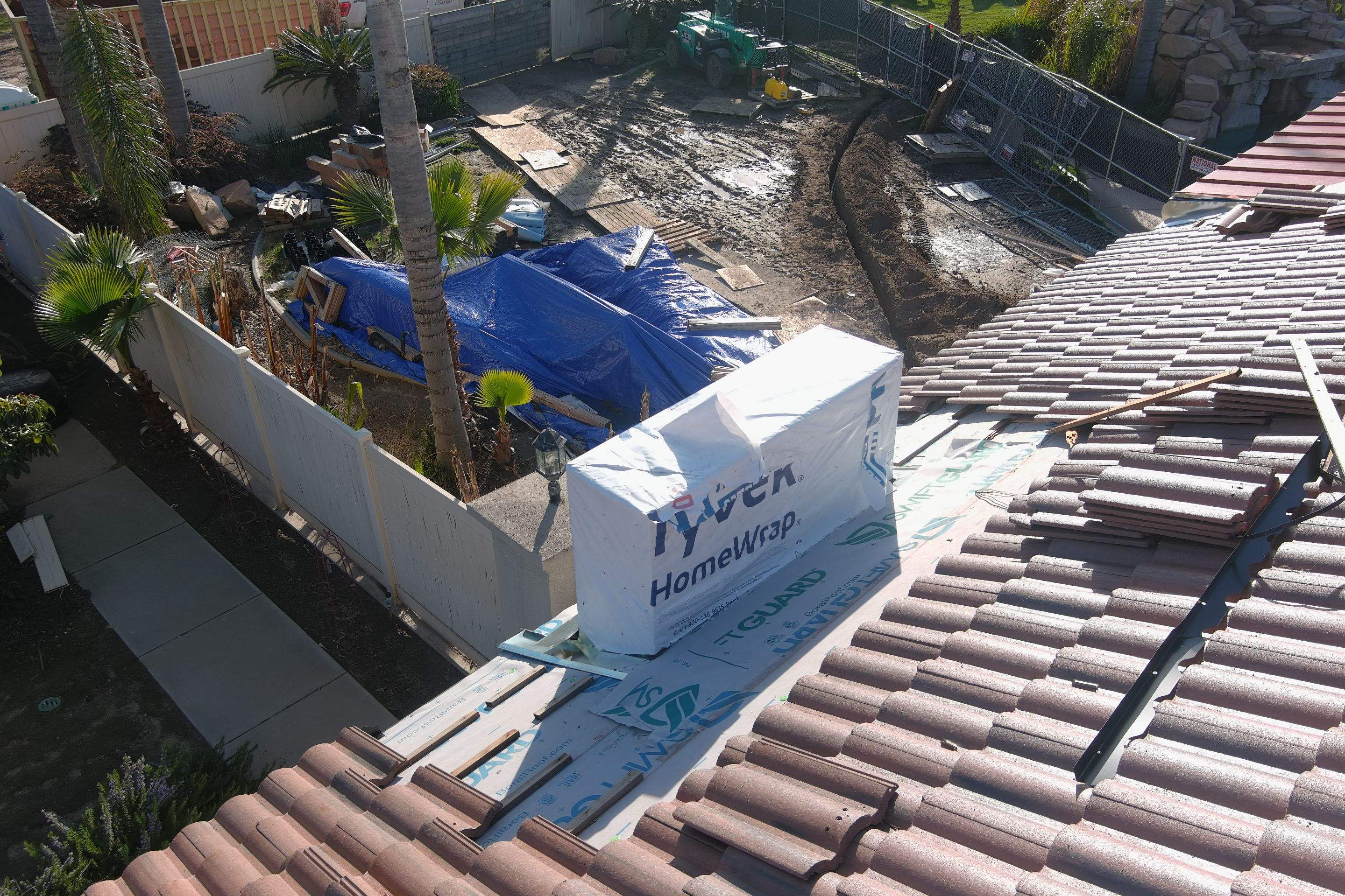 Tile, Metal, and TPO roofing project (new construction) by Straight Edge Roofing Inc