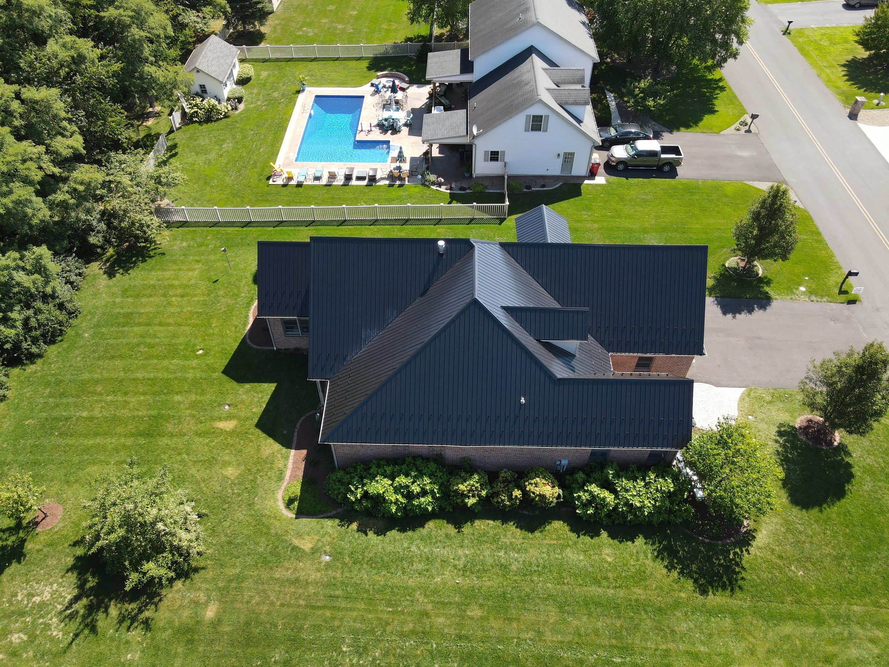 Standing seam / Azm panel in black  by Teflon Roofing