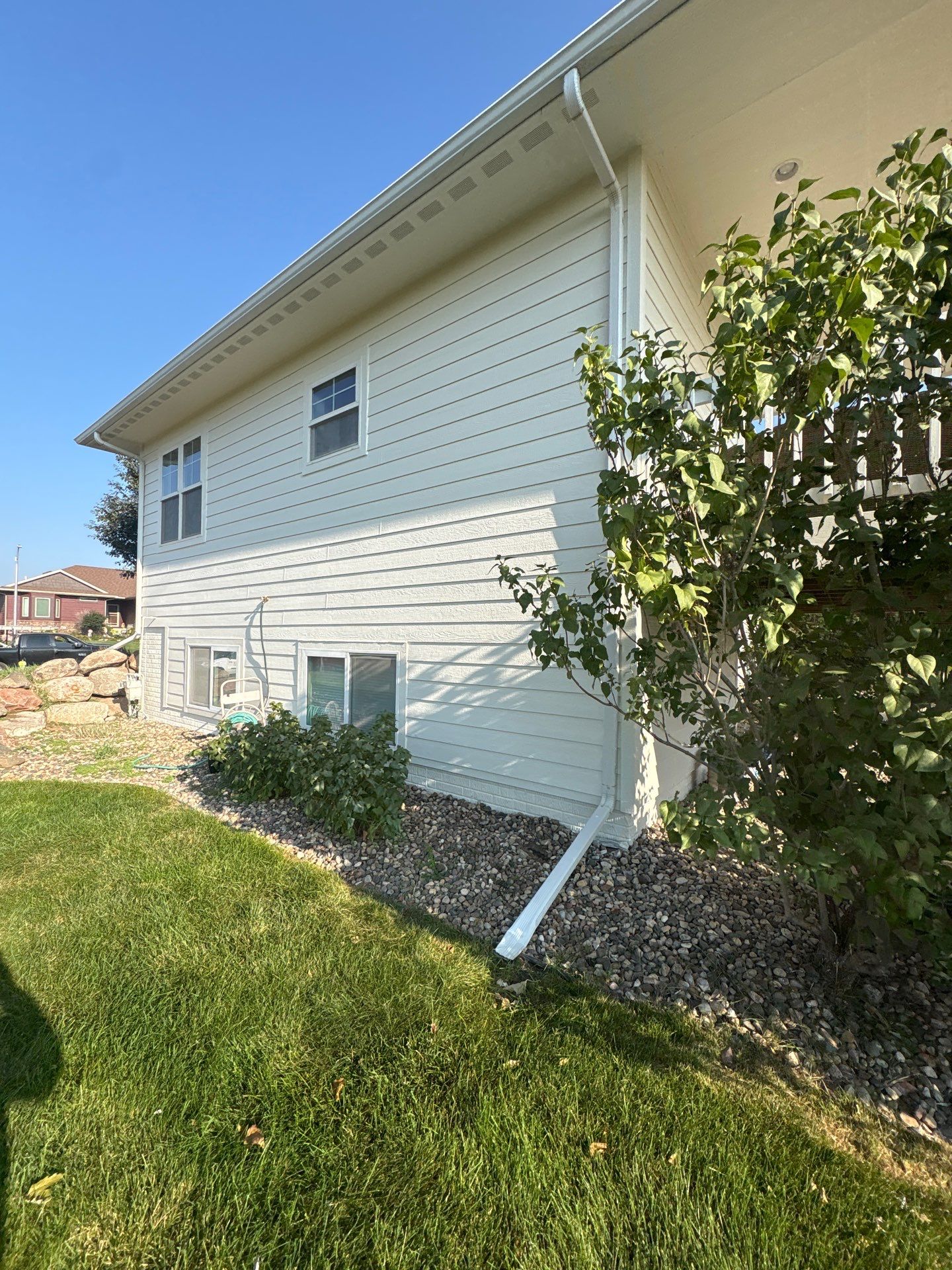 Sioux Falls Exterior Residential Siding and Deck Painting Project by Select Painting, Coatings & Garage Cabinets