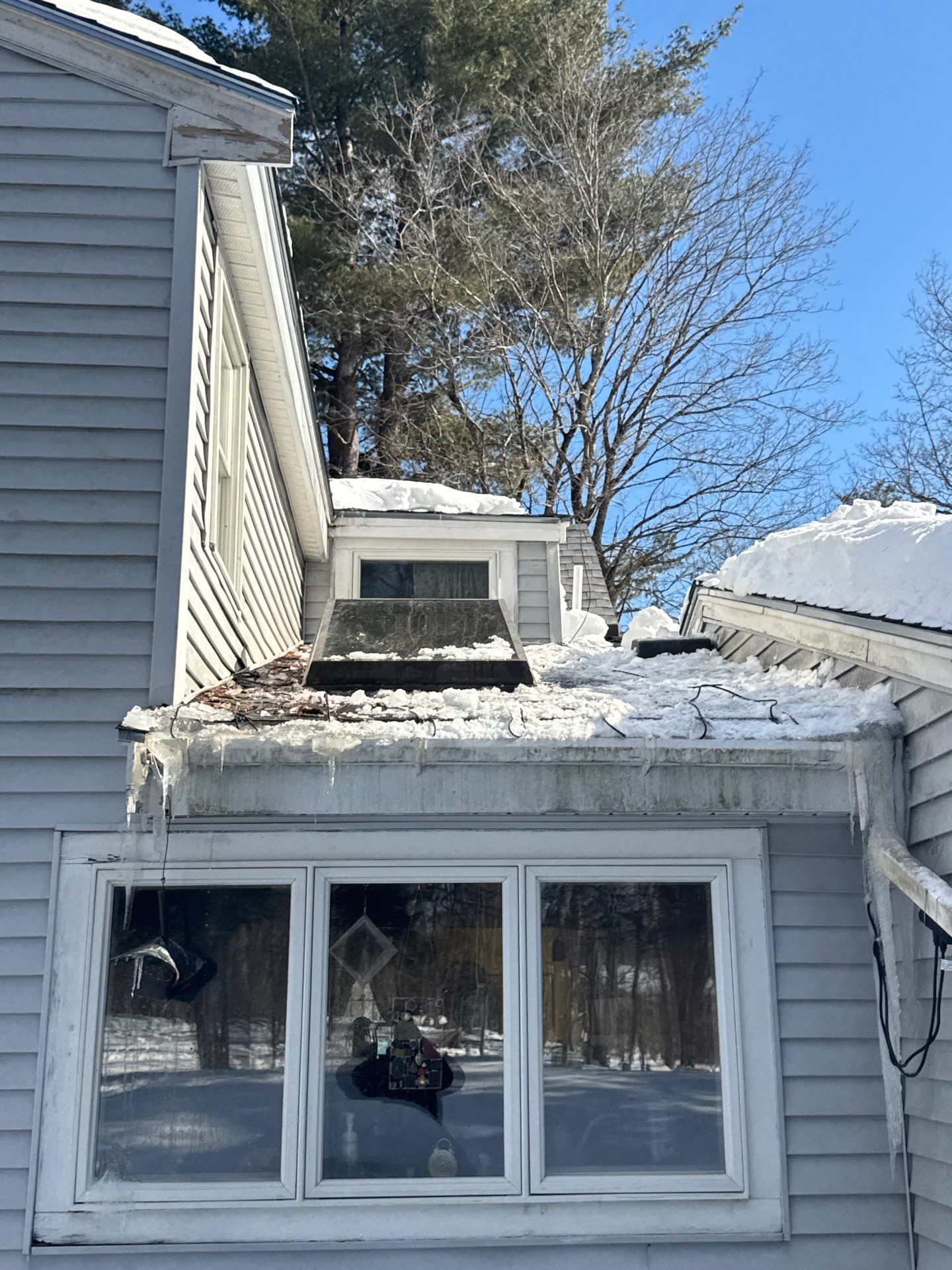 Ice Dam Removal, Snow Removal & Sidewall Flashing Repair in Acton, MA by Mighty Dog Roofing of Greater Middlesex County