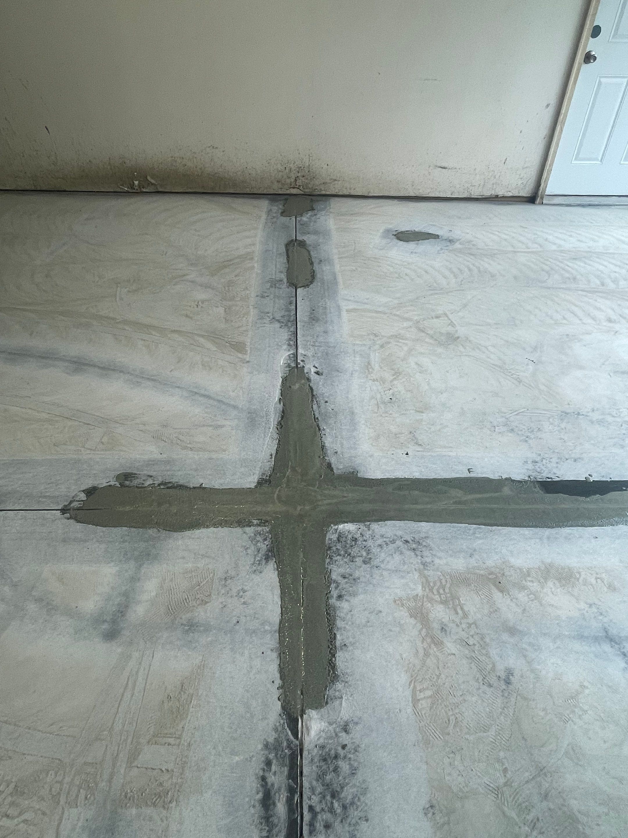 Multi-Stall Garage Floor Coating Installation in Sioux Falls by Select Painting, Coatings & Garage Cabinets