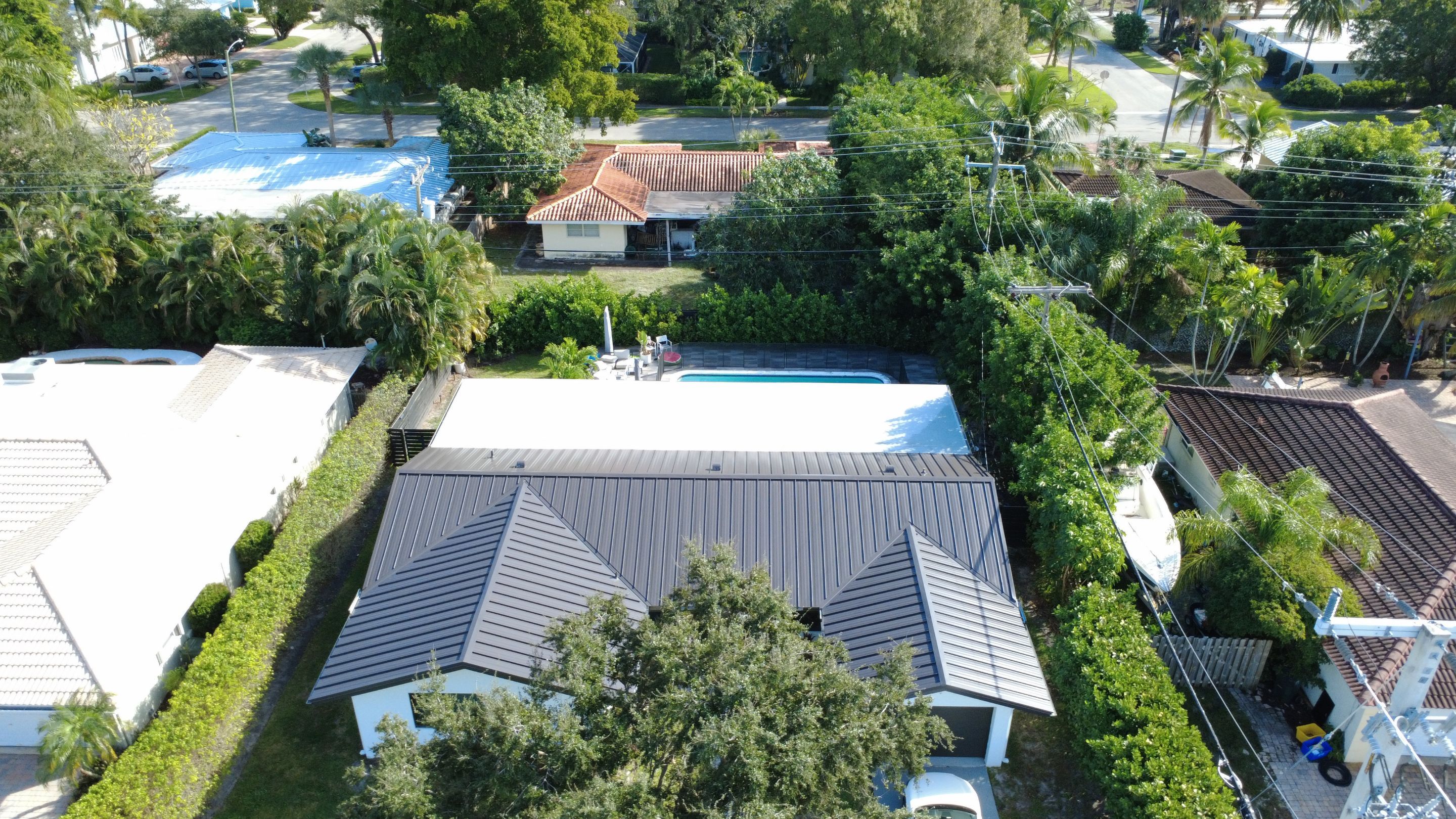 Residential Roofing Installation using 1" Nail strip metal roof by BLUES BROTHERS CONSTRUCTION CORP