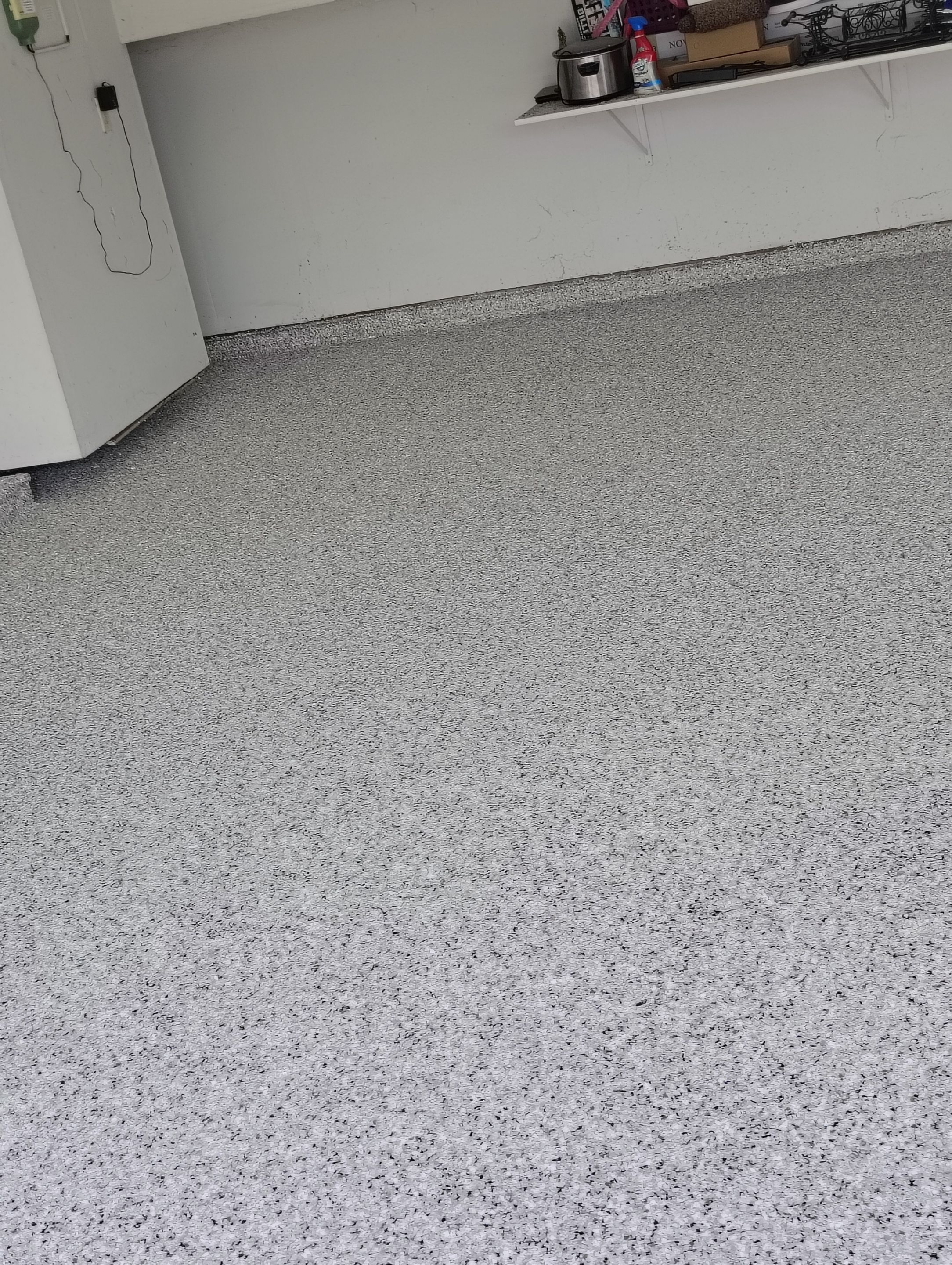 Decorative Chip Epoxy Garage Floor Coating in Sioux Falls by Select Painting, Coatings & Garage Cabinets
