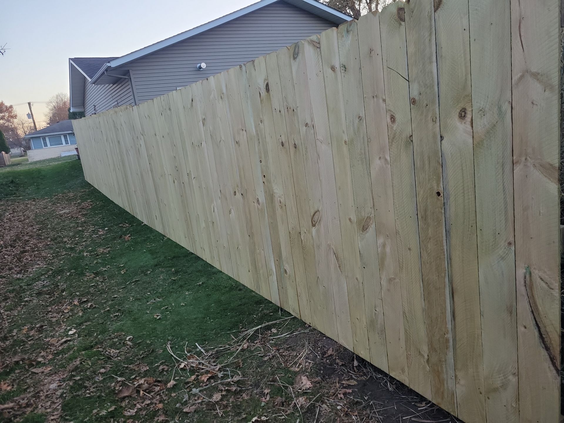 New Pressure-Treated Wood Privacy Fence and Gate in Charles City by Perfect Picket Fence and Stain