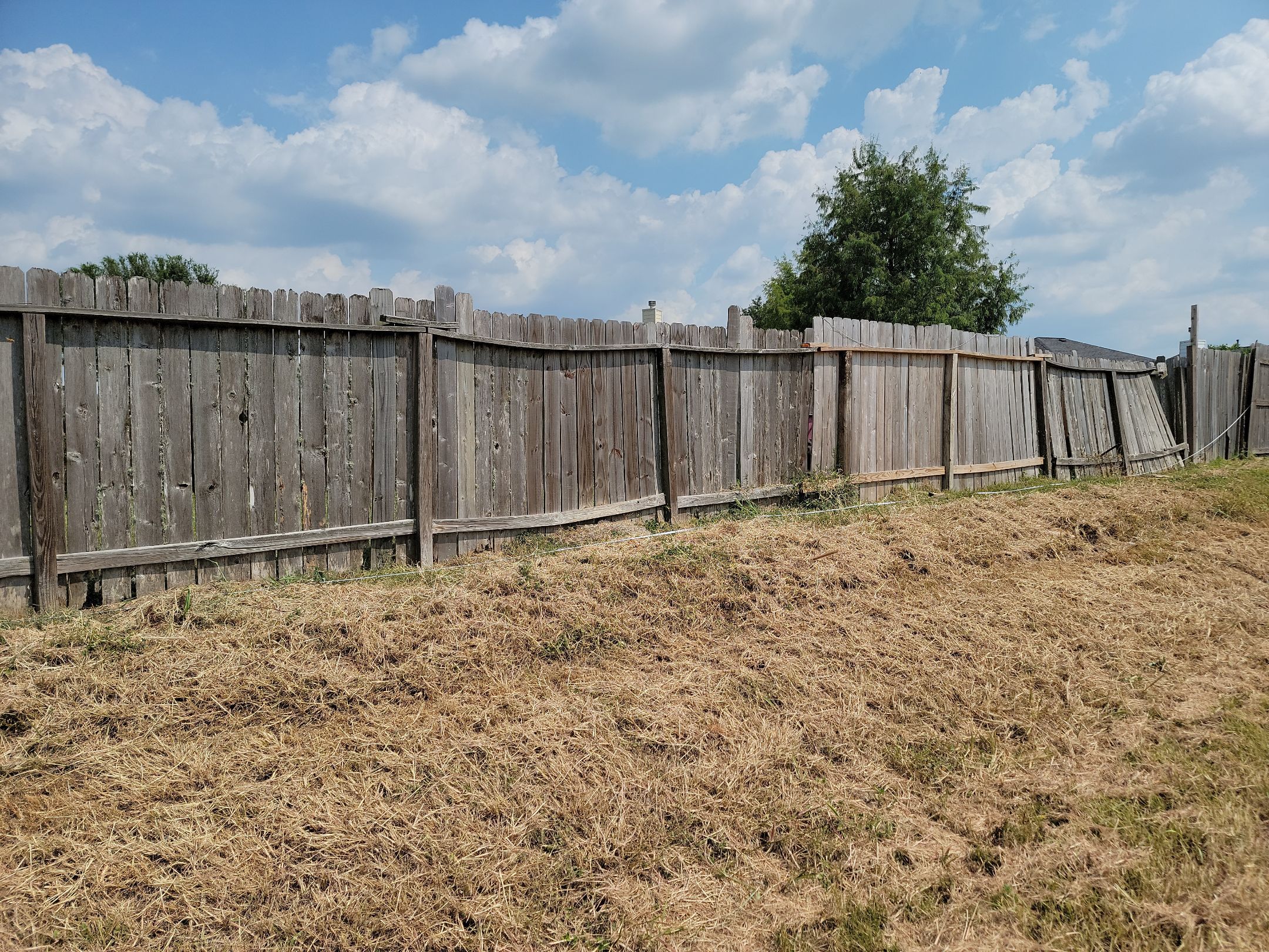 Beautiful Wood fence with metal posts by Tim's Fences