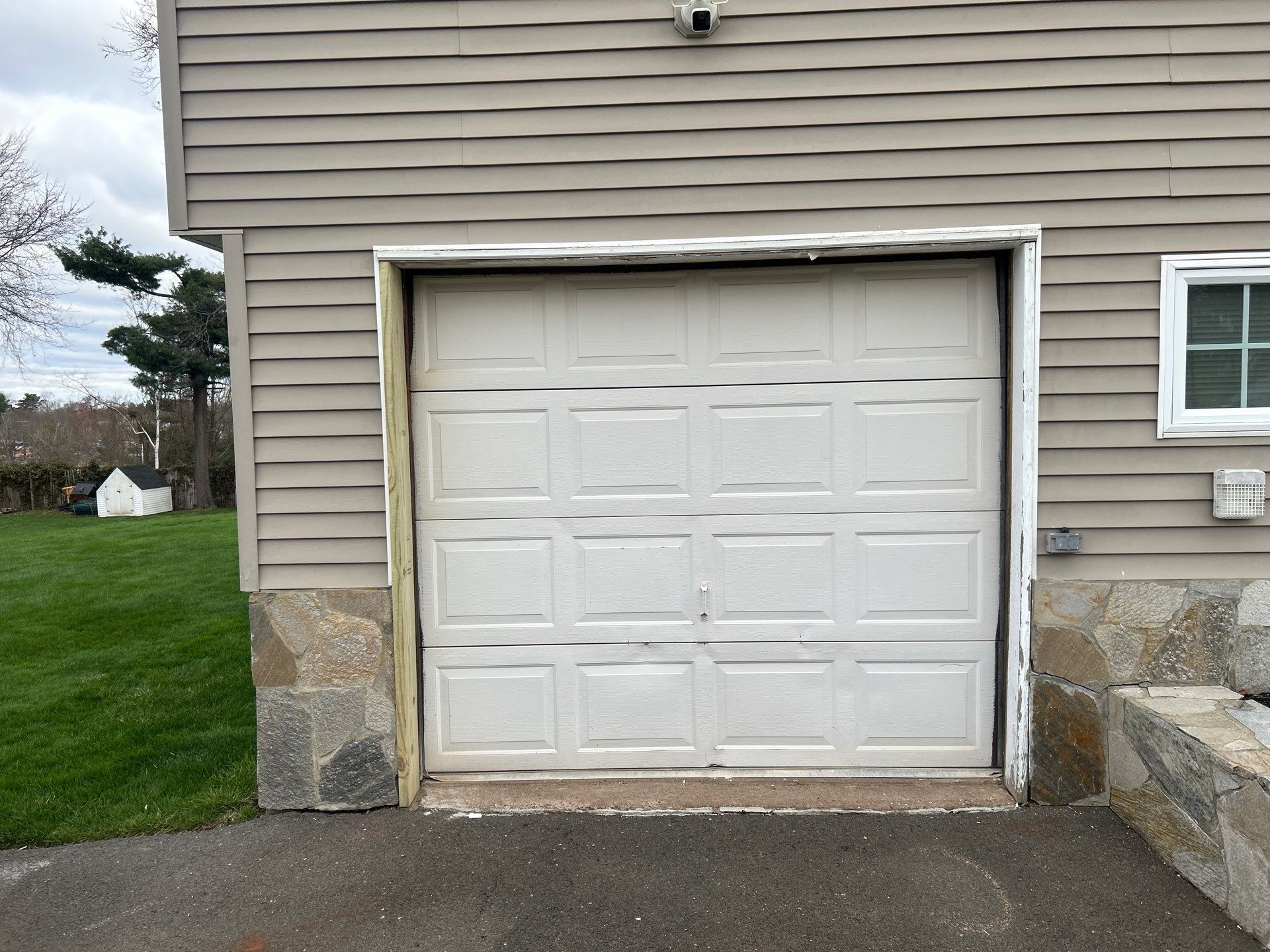 Classic Garage Door Upgrade with Refined Detail by DiGiorgi Roofing and Siding Inc