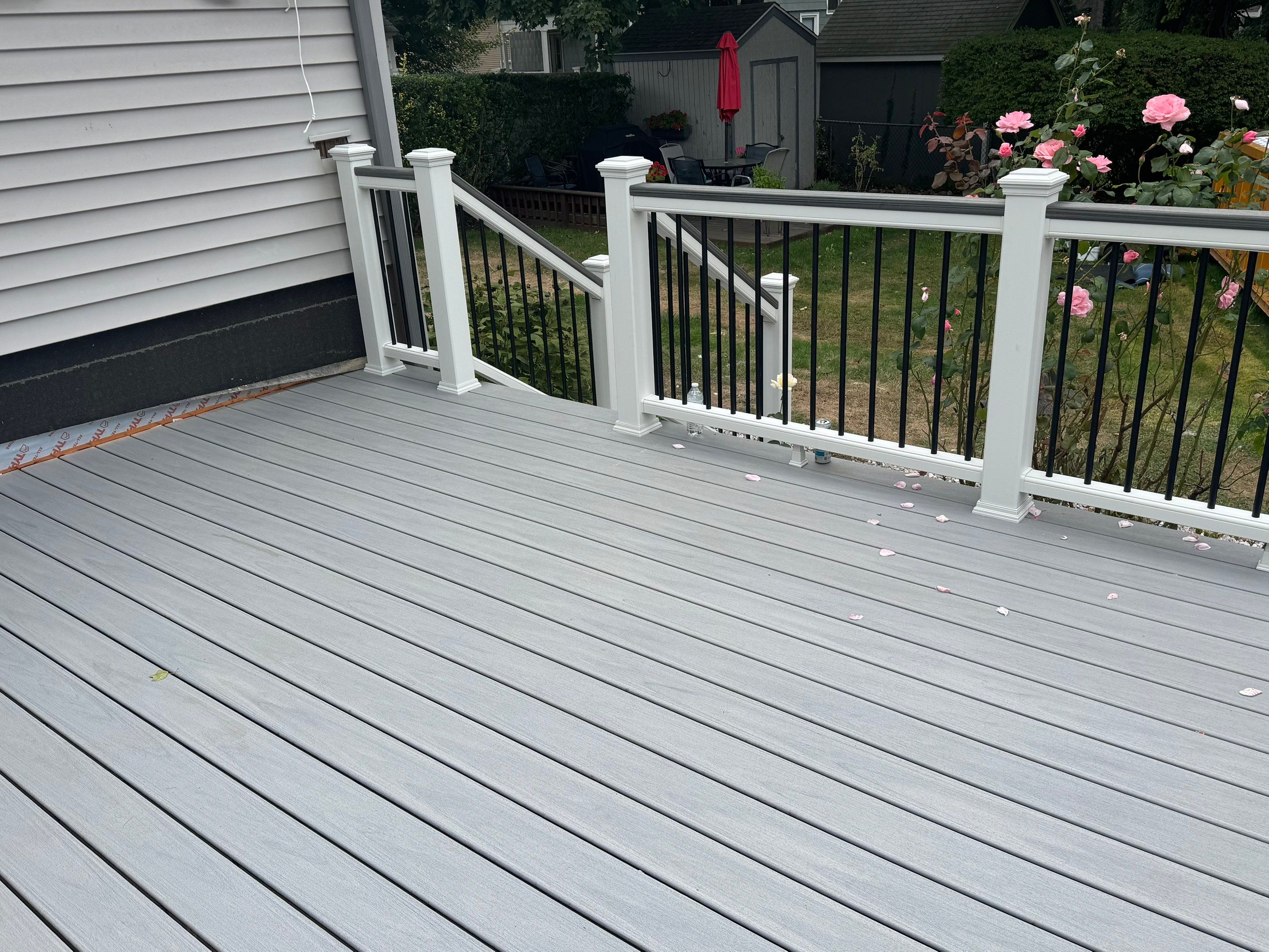 Deck Replacement using Trex Lineage Rainier with matching Cocktail rail and Lattice by DiGiorgi Roofing and Siding Inc