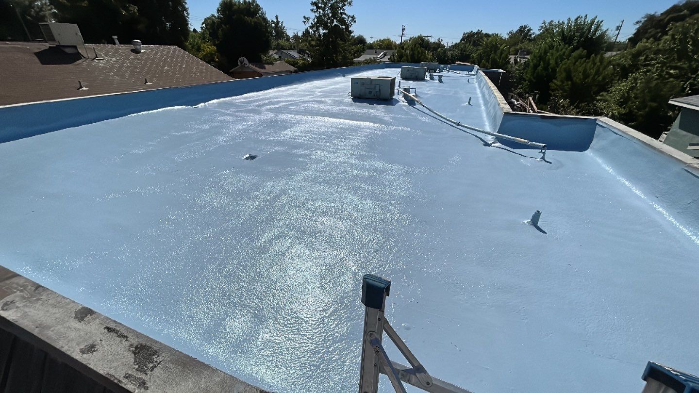 Foam Refurbish using Conklin Benchmark/PUMA XL coatings and spray foam; Also metal roofing around parapet wall by Straight Edge Roofing Inc