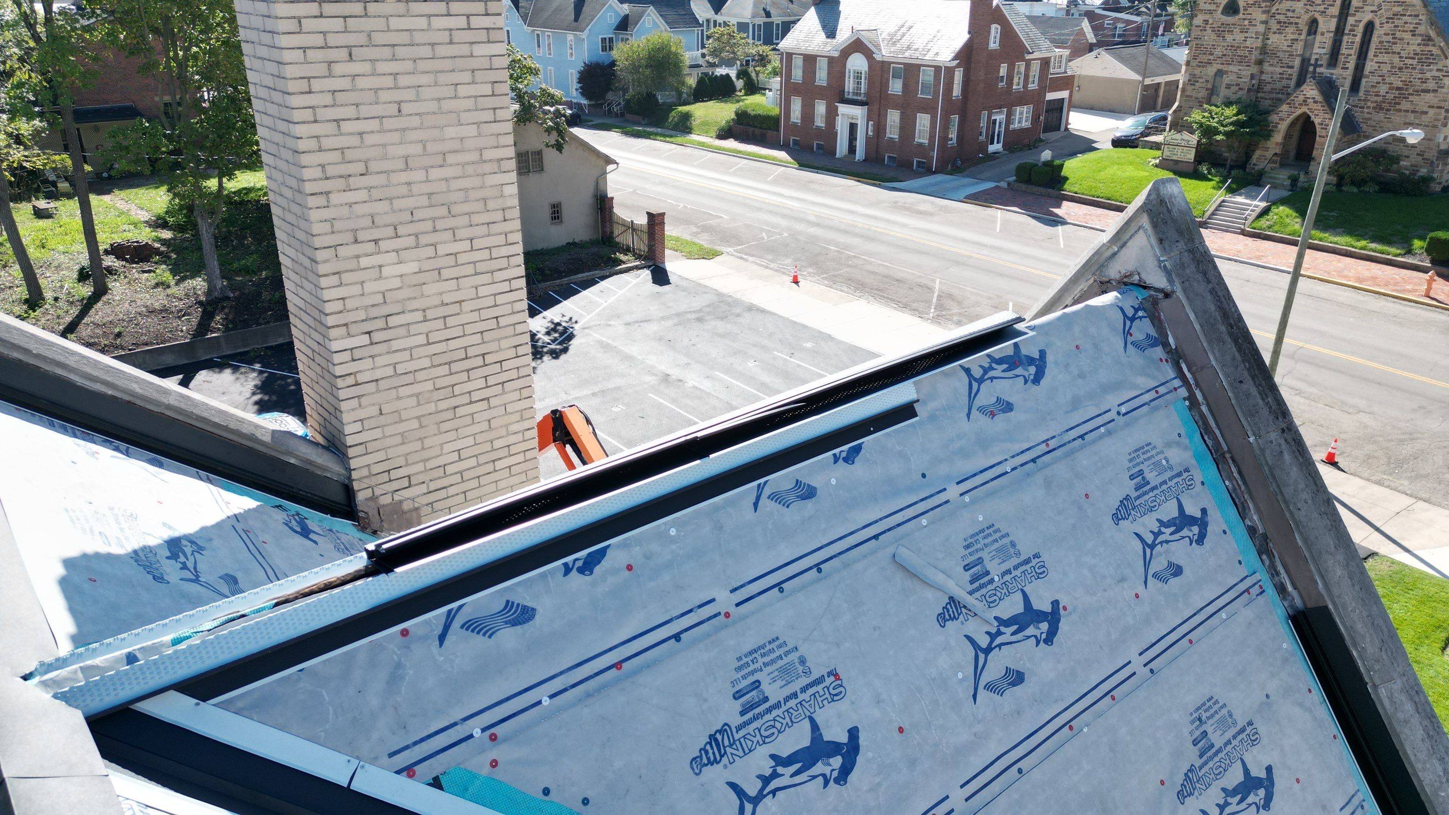 Commercial Roofing Installation using Standing Seam Metal - Frost Black by RoofX 