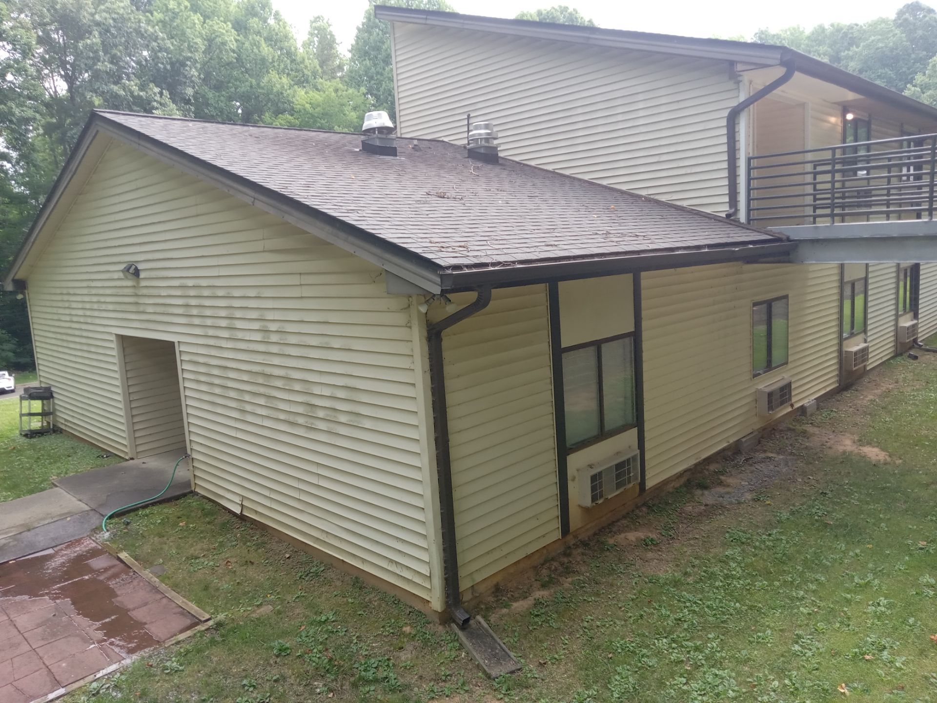 pressure washing exterior house siding and possibly concrete surfaces to remove dirt algae and mildew