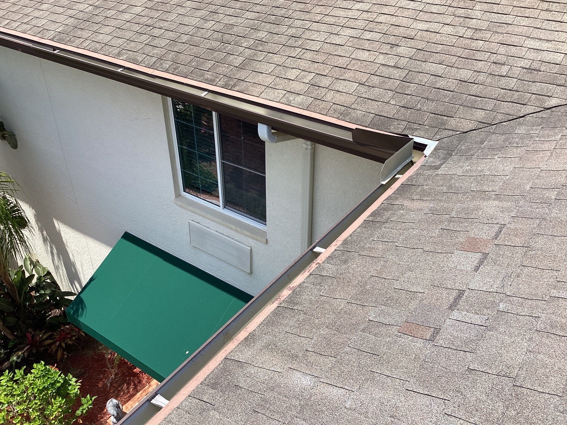 Musket Brown Seamless Gutters using Musket Brown Seamless Gutters in Capen Coral FL by Gutter Professors