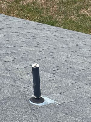 Plumbing vent pipe on architectural asphalt shingle roof