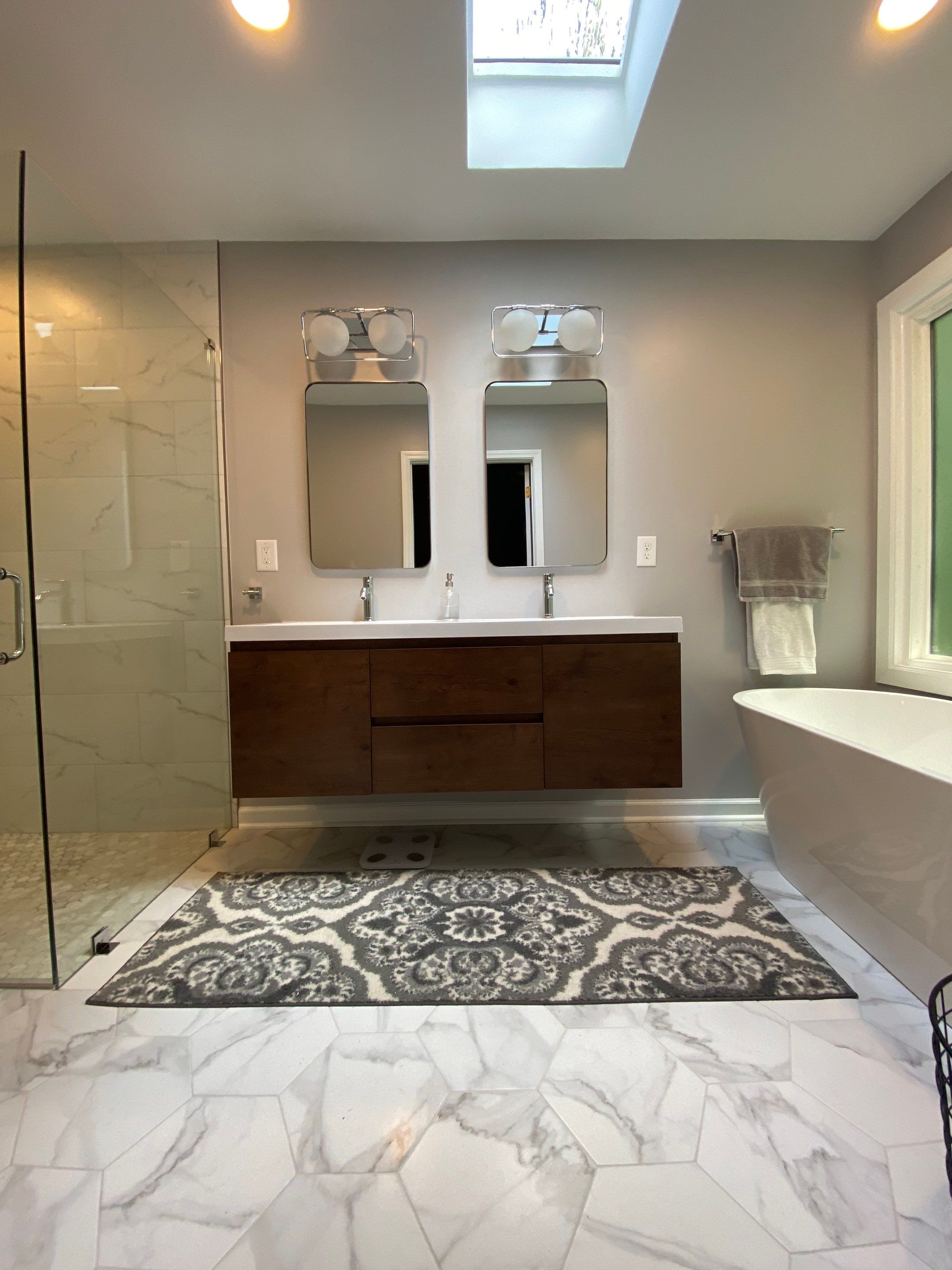 Luxury Bathroom Remodel with Marble Tiles in Kennesaw by Swift Home Renovations 