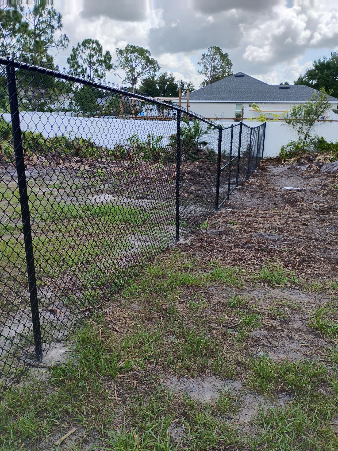 Black Chain Link and Vinyl Privacy Fence Installation in North Port by True Fence LLC