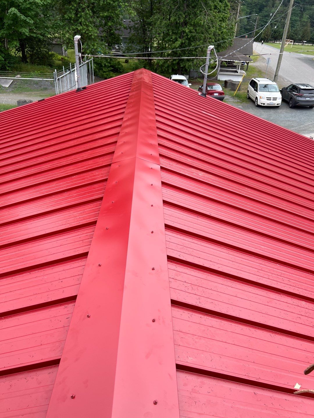 Commercial Roofing Installation using 12" Prolok metal  by Top Notch Roofing Inc