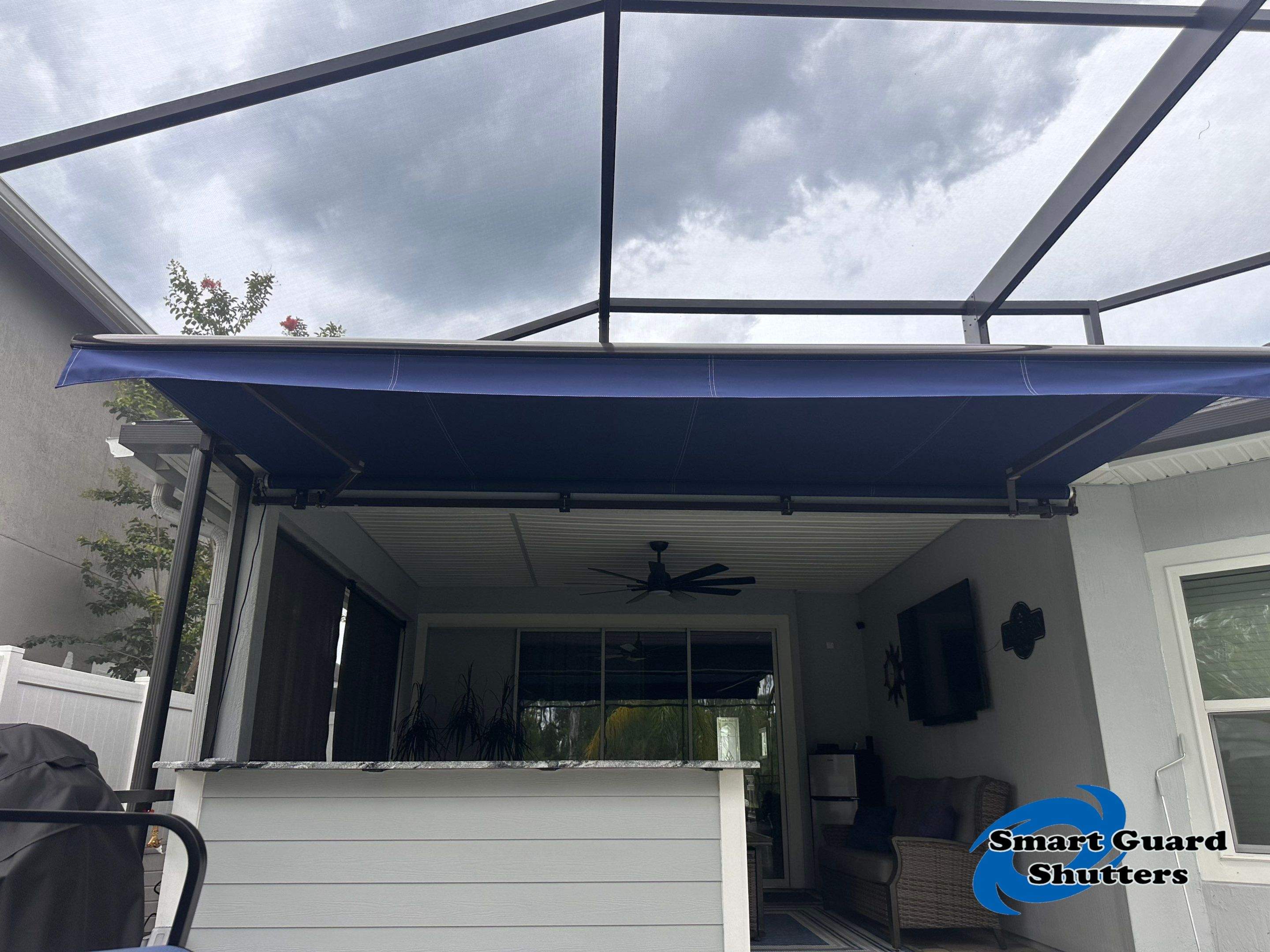 Retractable Awning in Marine Blue  by Smart Guard Shutters