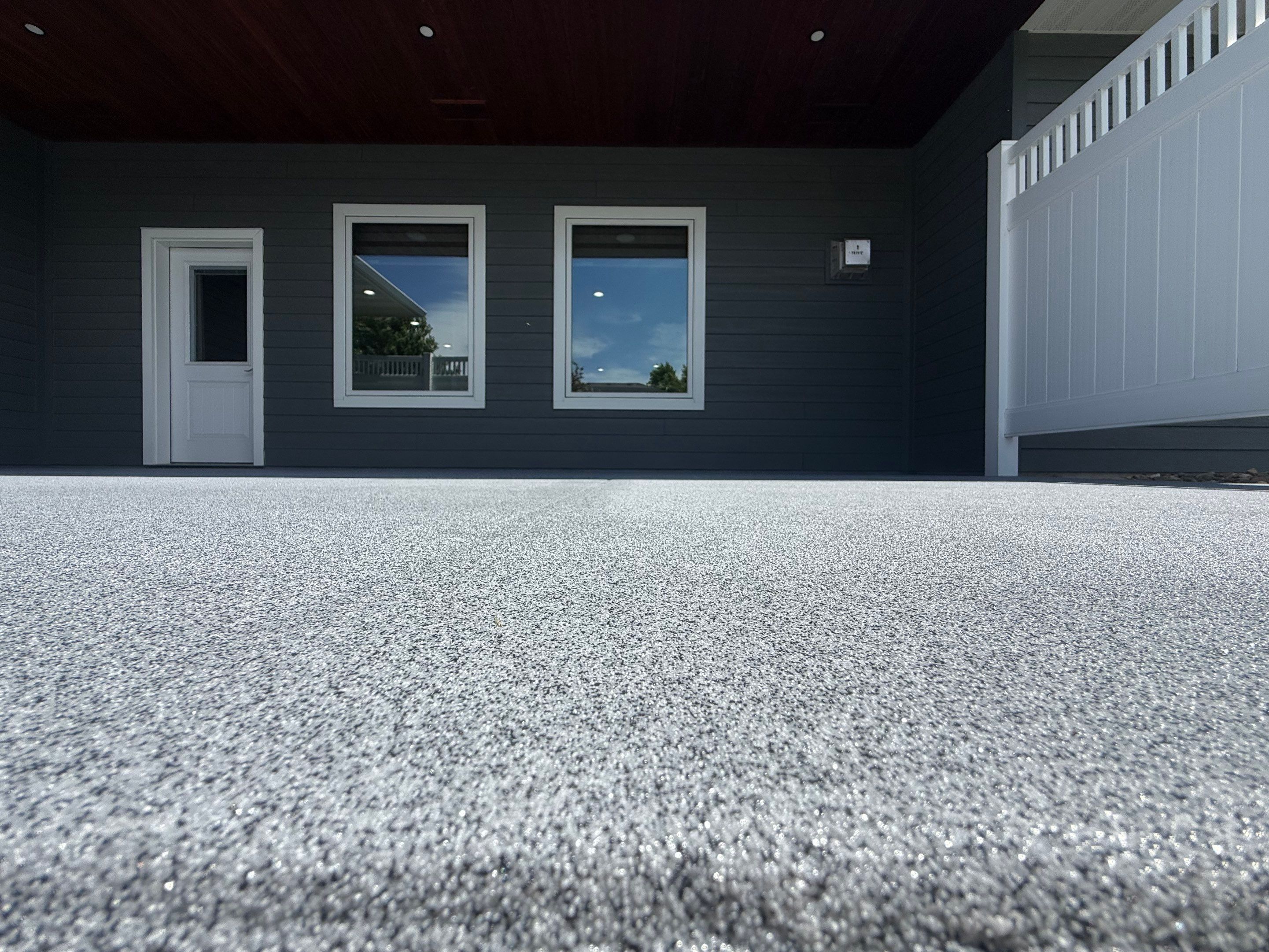 Polyurea Patio Floor Coating in Starry Evening for Sioux Falls Home by Select Painting, Coatings & Garage Cabinets