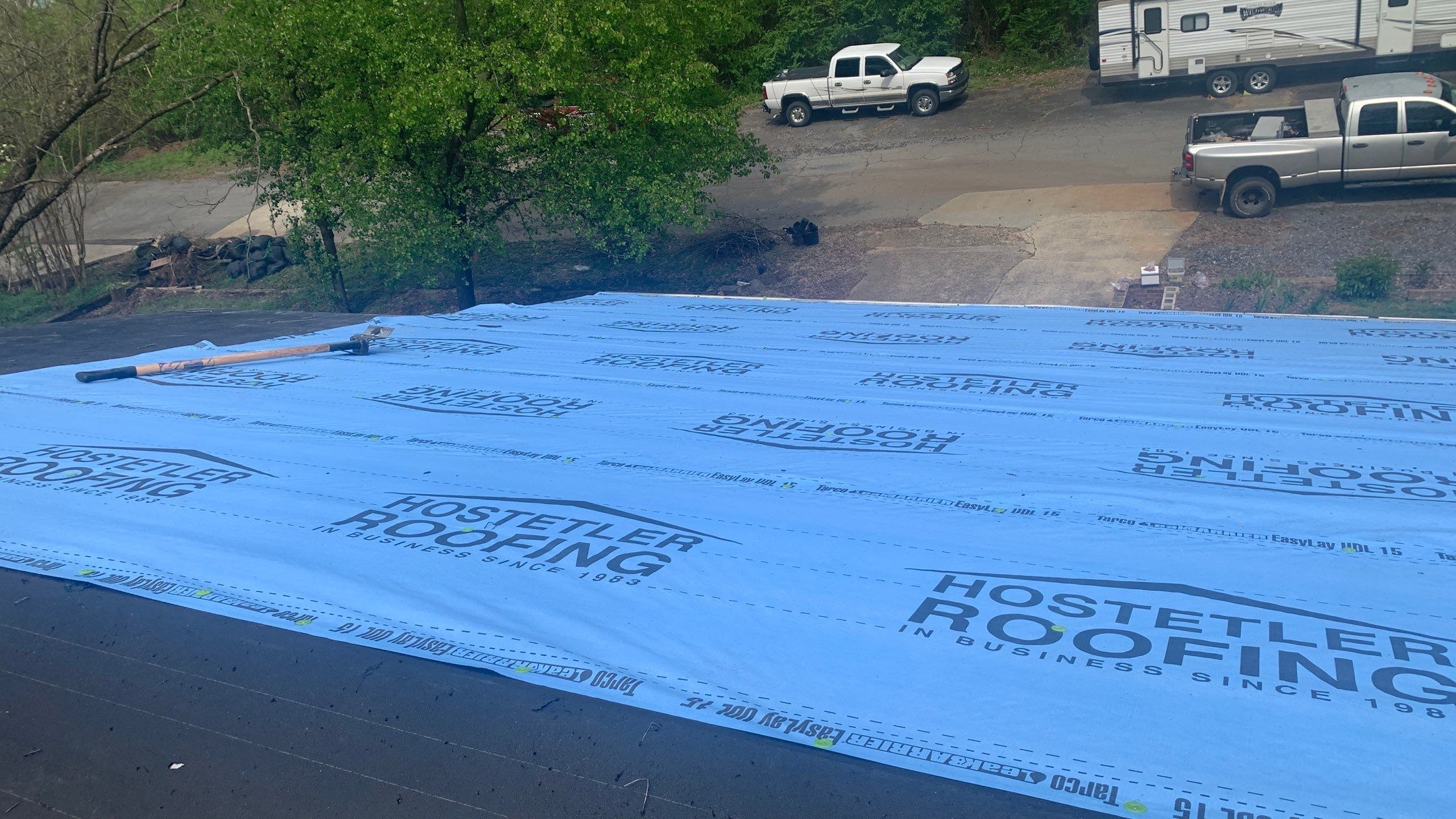 Residential Roofing Installation using 26 Gauge Colored Panels by Hostetler Roofing
