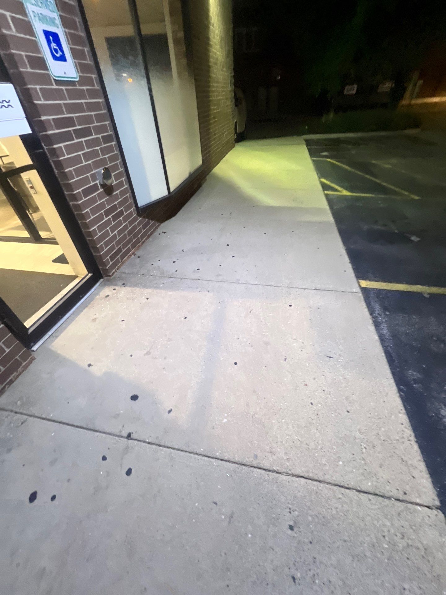 Commercial sidewalk cleaning. by Northern Power Washing LLC.