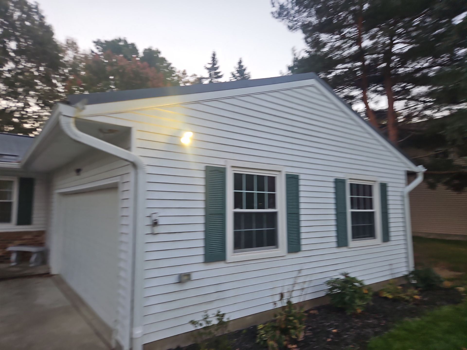 Wadsworth Exterior Transformation Featuring Blue Vertical Siding and Metal Roofing by Cornerstone Roofing And Siding