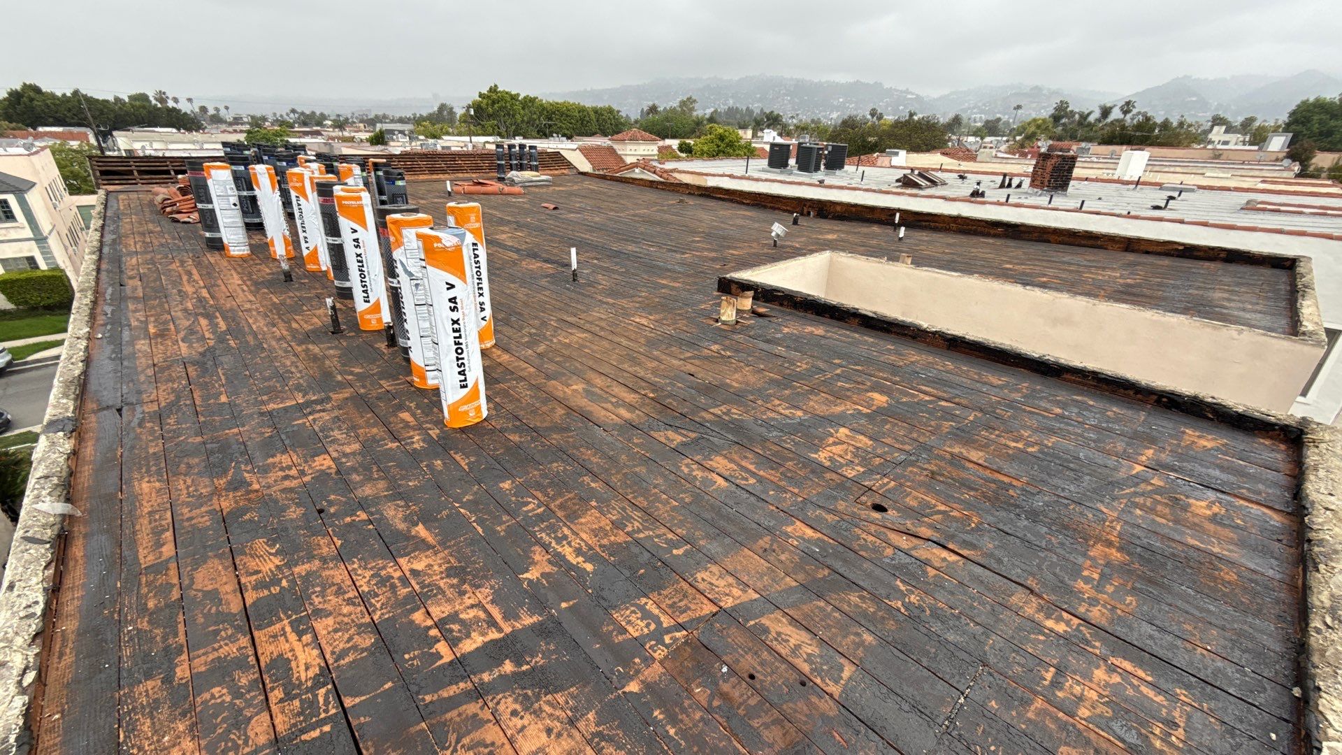 Apartment Building Reroofing using Polyfresko® G Highly Reflective Modified Bitumen Cap Sheet by Hull Brothers Roofing