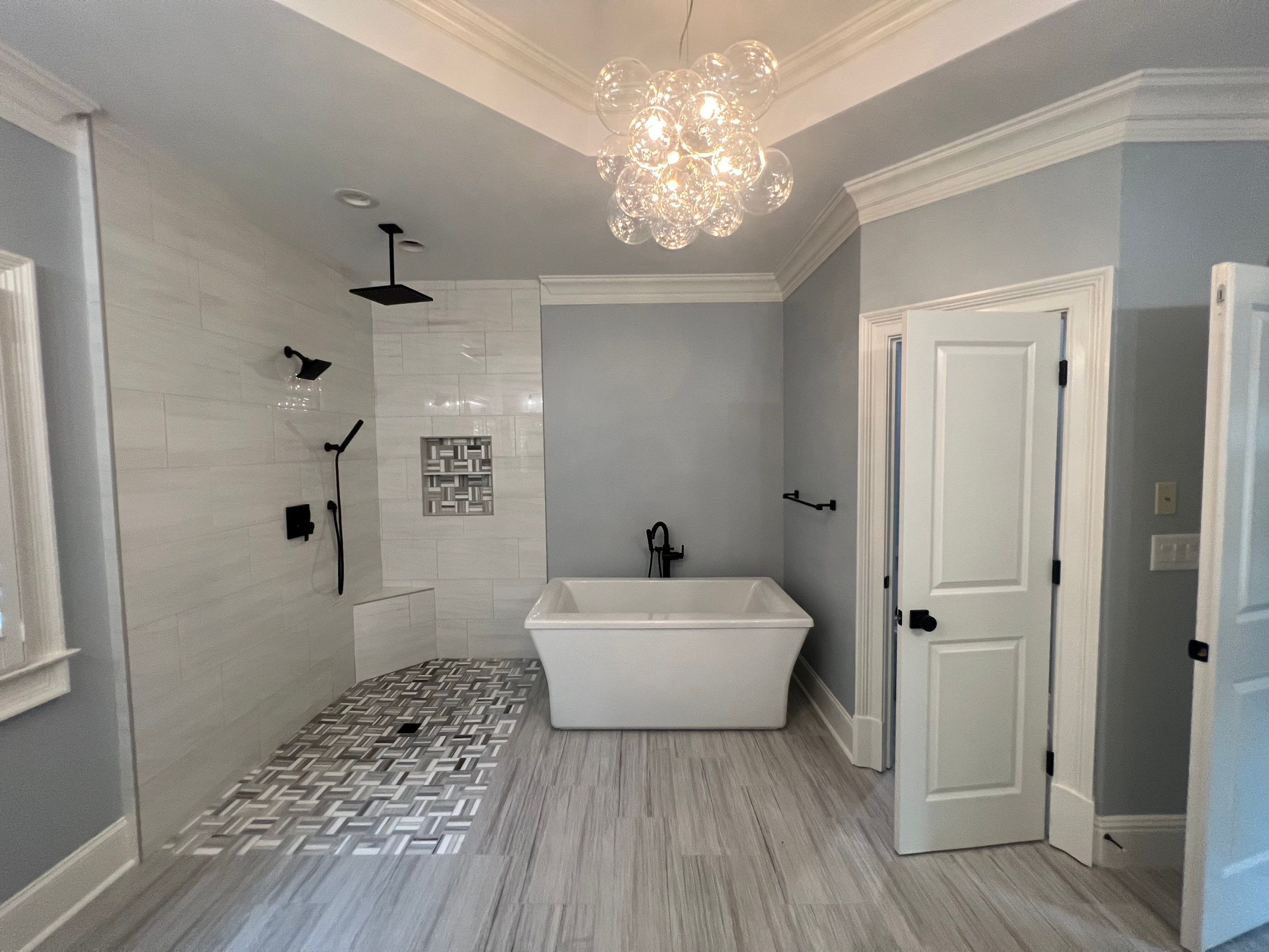 Modern Master Bathroom Renovation With Freestanding Tub in Smyrna by Swift Home Renovations 