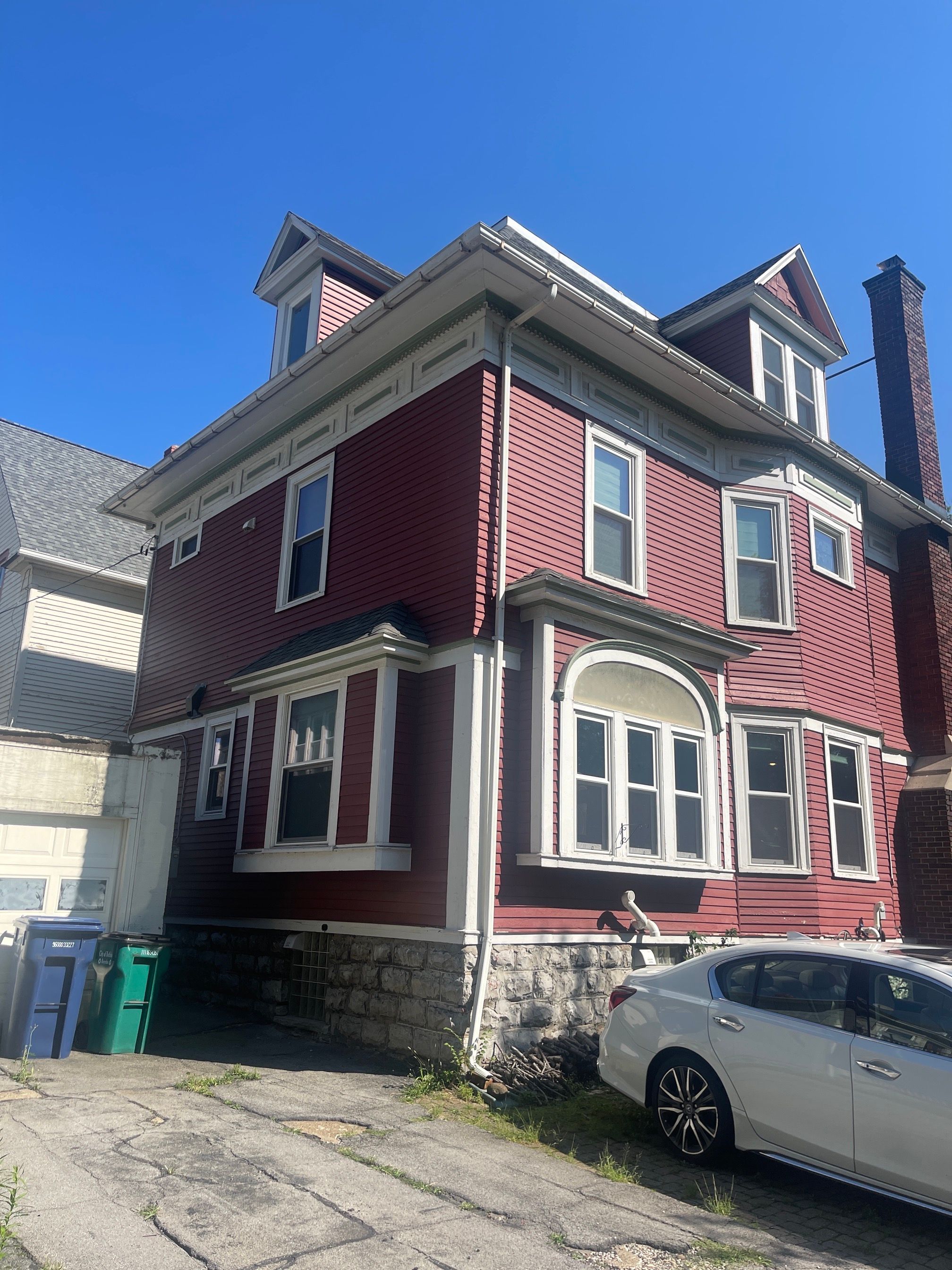 Exterior Renovations- Siding, Stamped Concrete, Porch, and Railings by Ivy Lea Construction