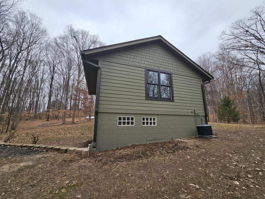 Siding Installation using Primed James Hardie & Straight Edge Shakes by Koontz Construction