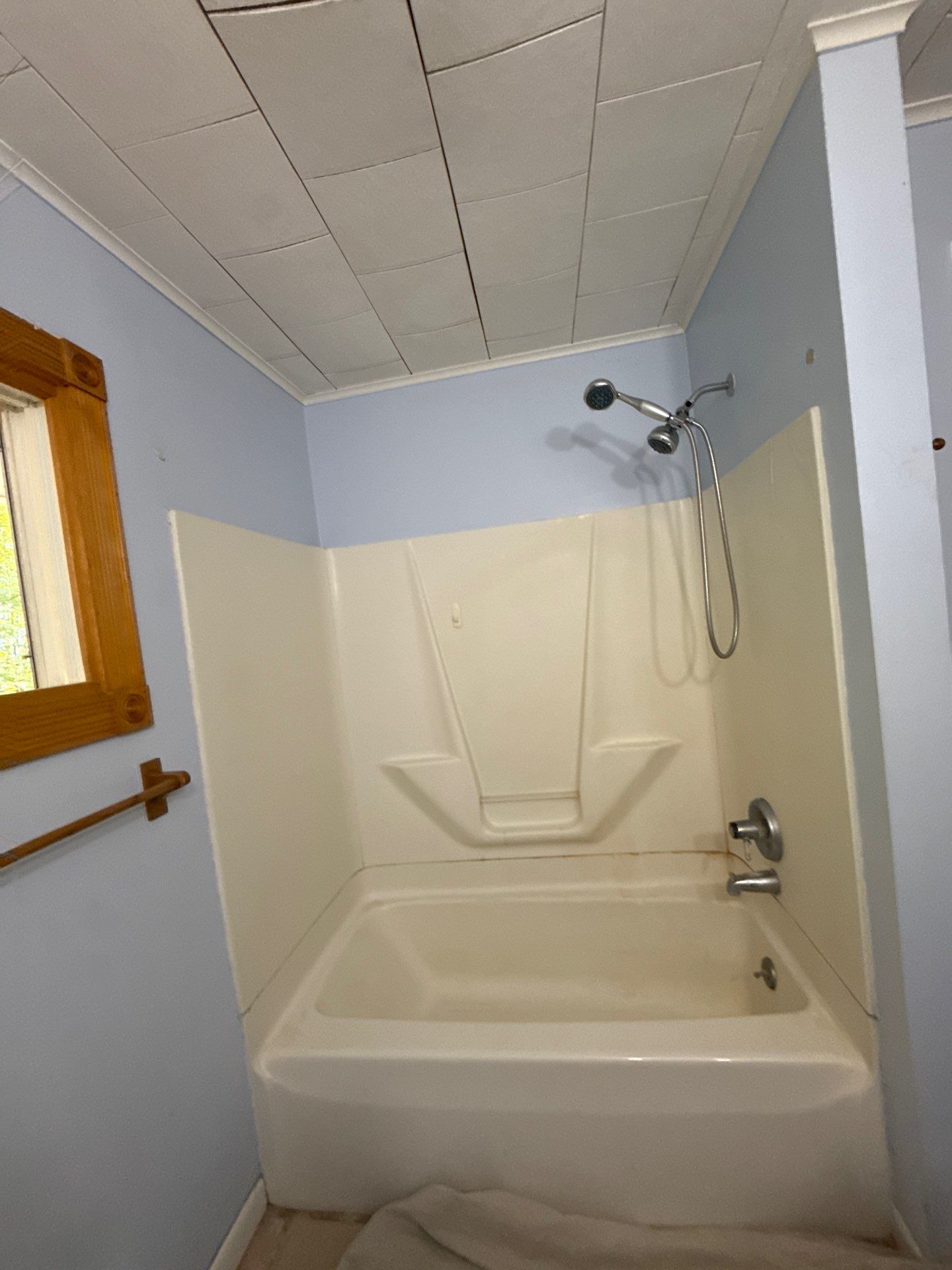 White Subway Tile Walk-In Shower Conversion in Cadillac by Rainbow Seamless Systems