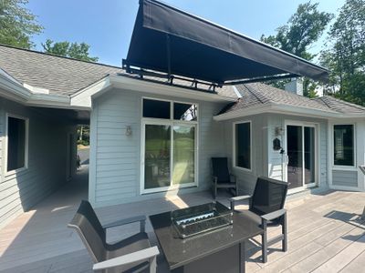 Black Sunesta Retractable Awning Installation in Harbor Springs