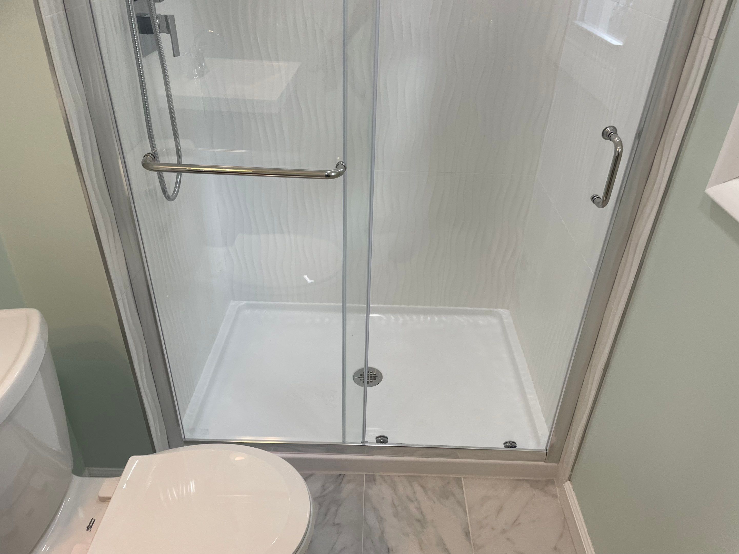 Bathroom Remodel using Tile by Home Concepts Construction