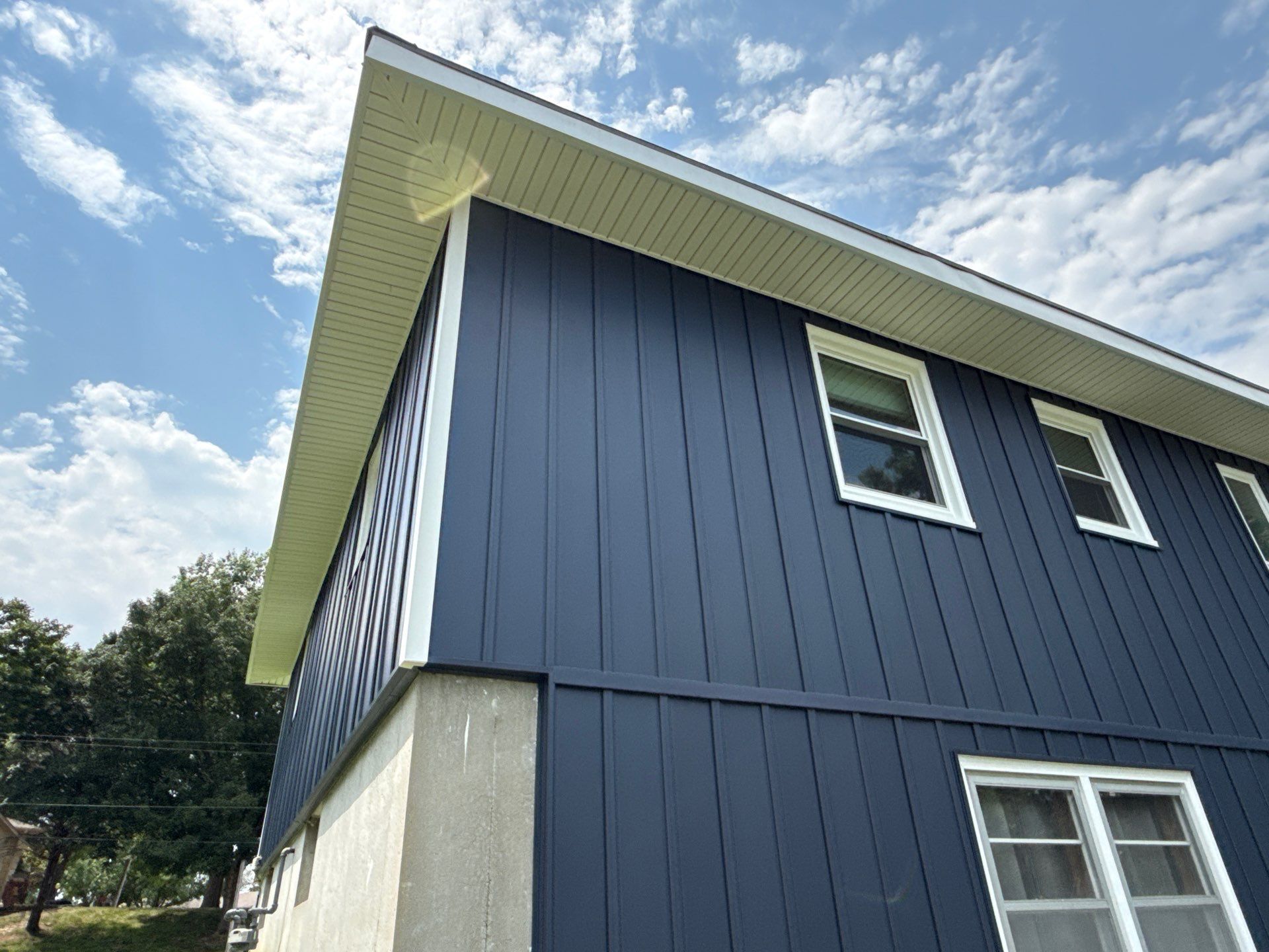 Indigo Board and Batten Siding and Window Replacement in Smithville by EEC Windows, Siding & Roofing