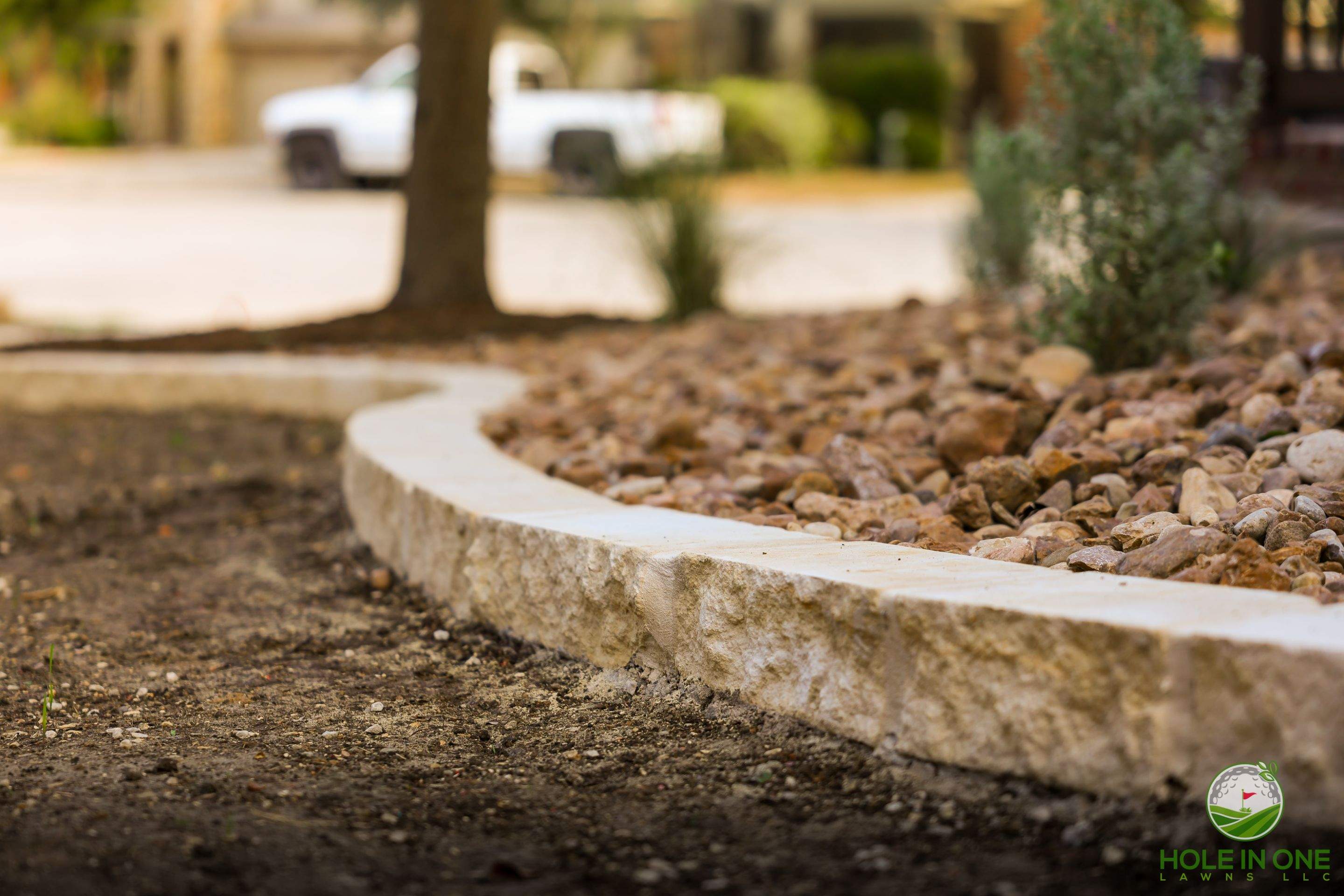 Low-Maintenance Front Yard Xeriscape with Chopstone Border, North San Antonio TX by Hole In One Lawns, LLC