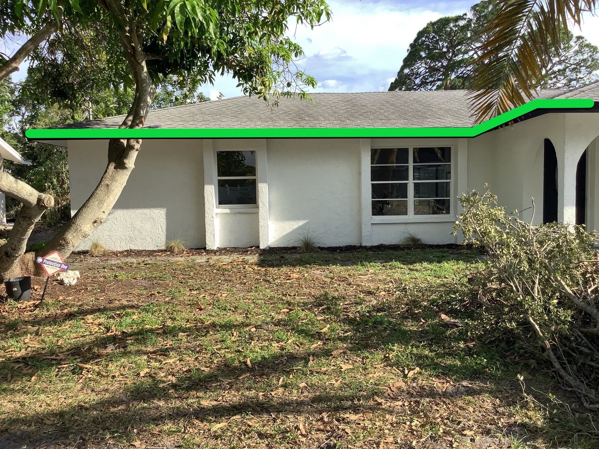 Black seamless gutters and downspouts installation in Sarasota, FL by Gutter Professors