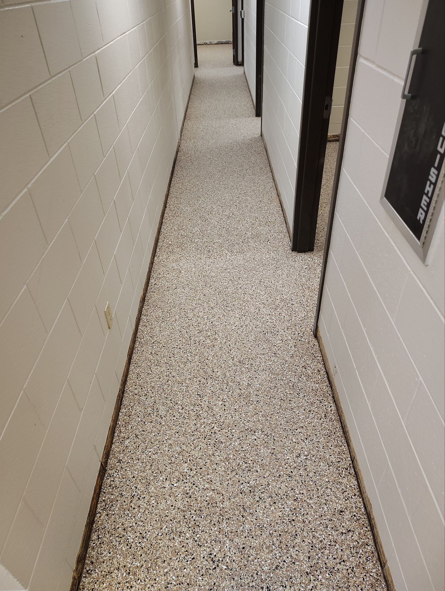 Industrial Flake Epoxy Floor Installation at Pierre National Guard Facility by Select Painting, Coatings & Garage Cabinets