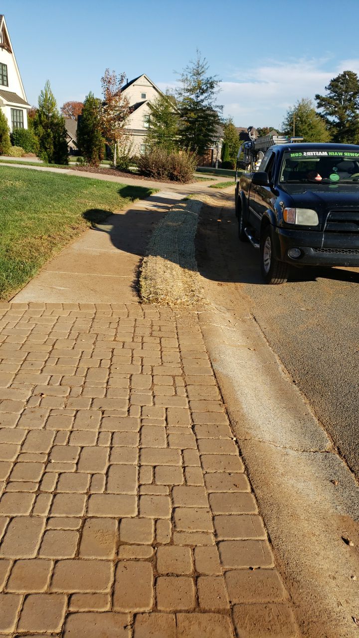 Driveway Clean using cleaner by Power Wash Masters LLC