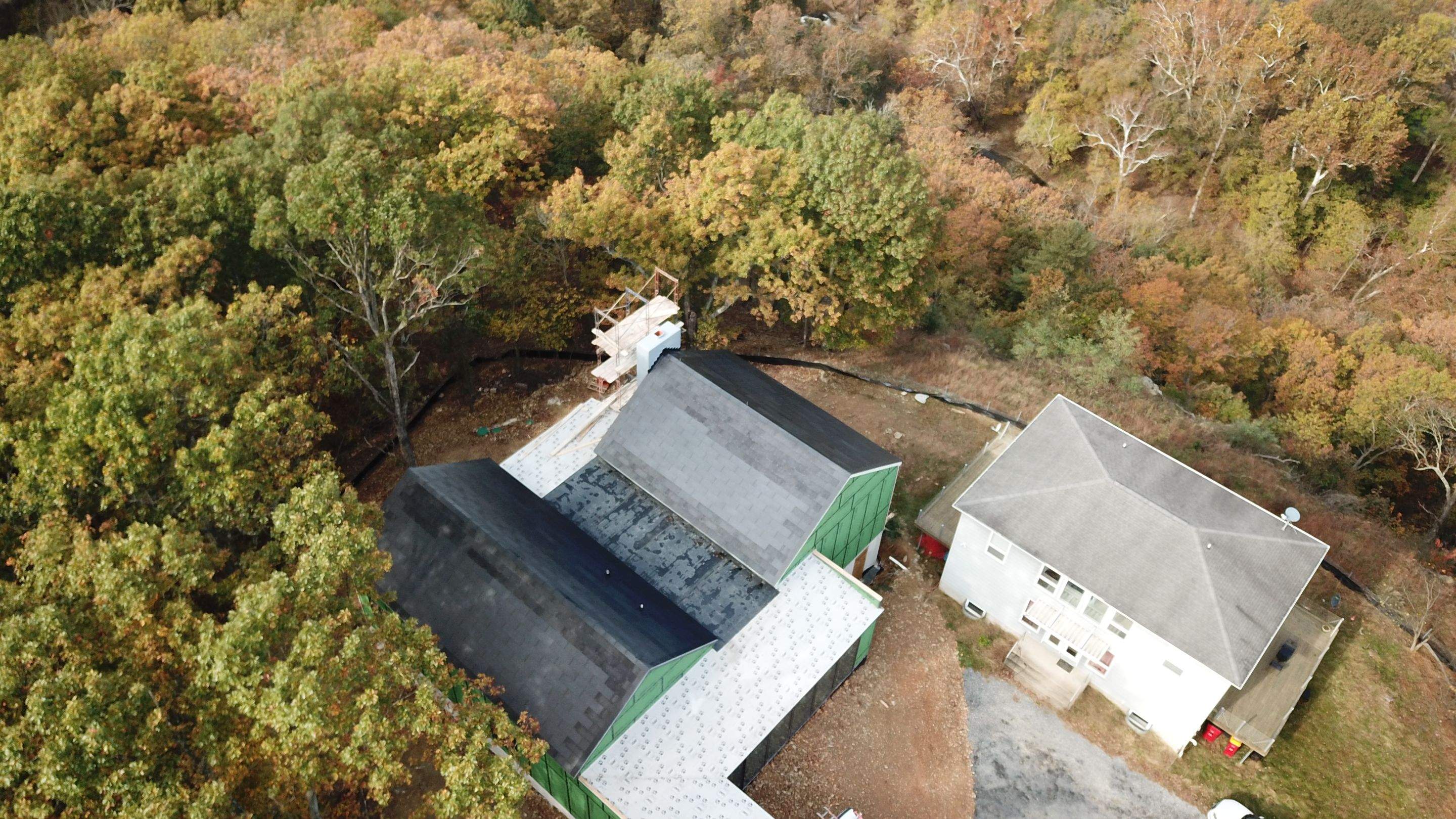 Roof Installation using Tesla Solar Roof V3 by American Home Contractors