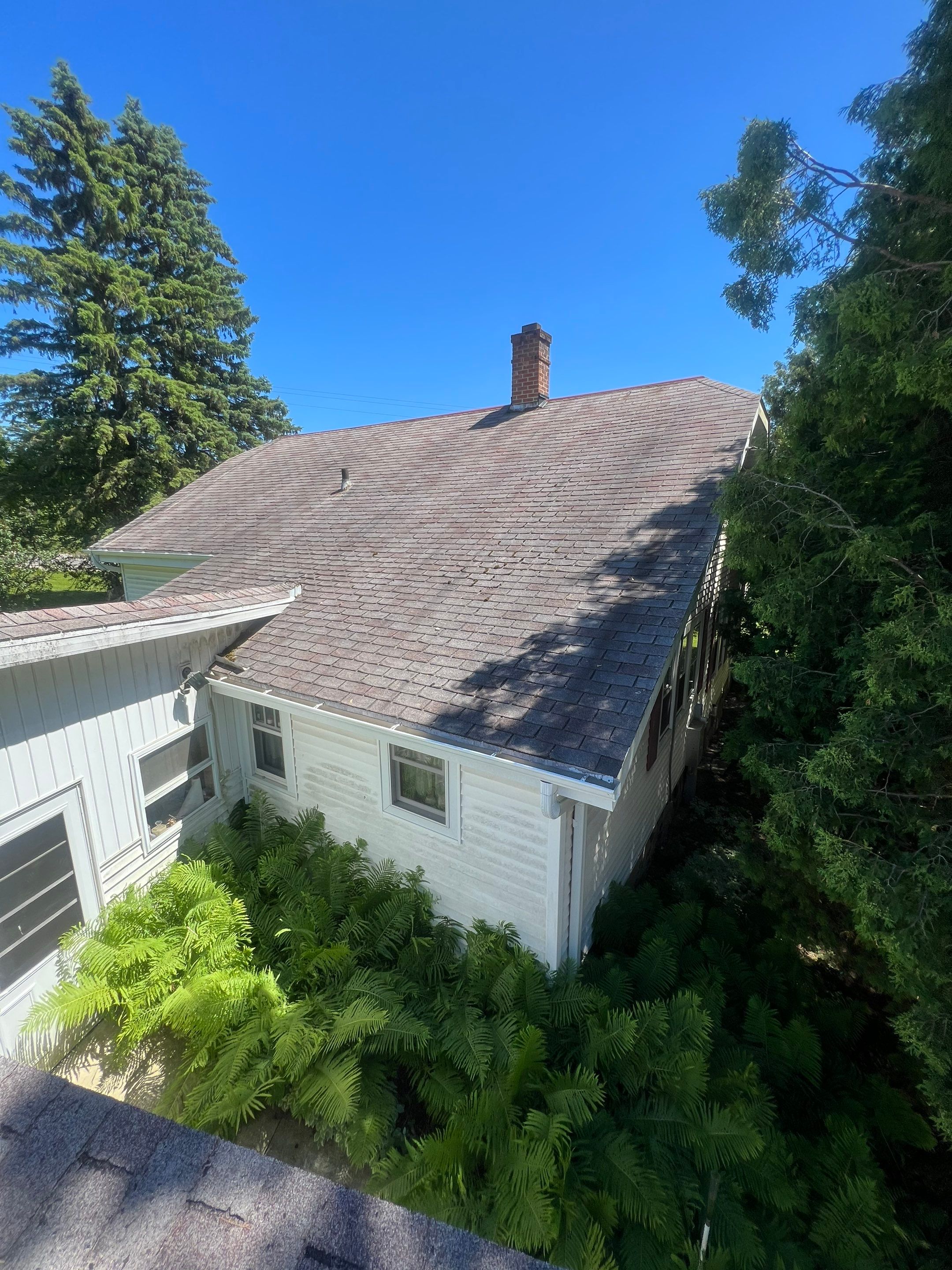 Residential Roof Installation with Red Pro Rib Metal Roofing in Adell, WI by Gellings Roofing & Siding