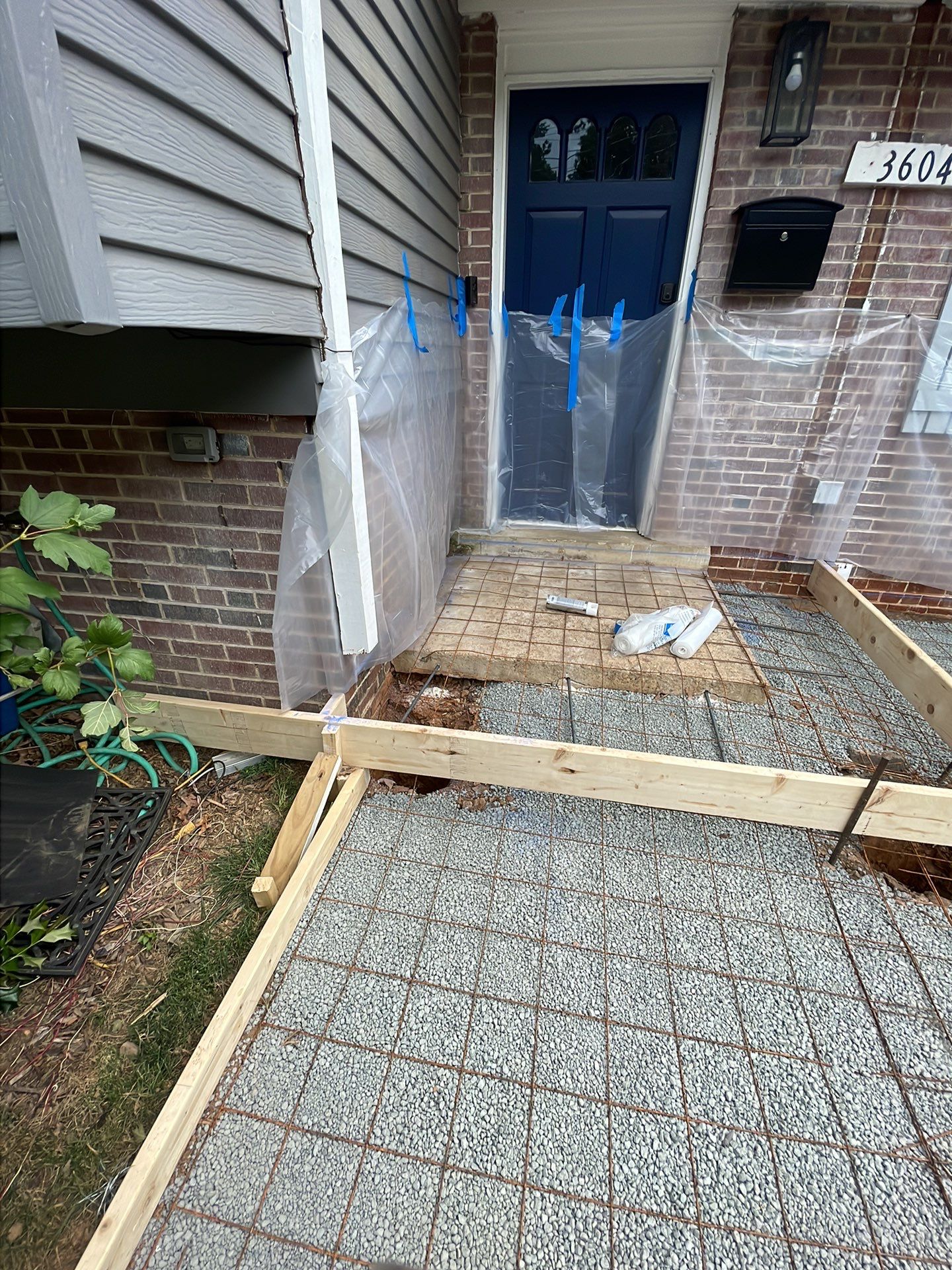 New walkway with stairs and a new front porch by Fairfax Contractors, LLC