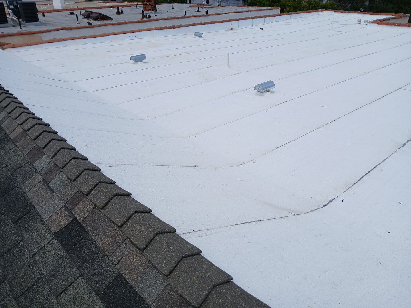 Apartment Building Reroofing using Polyfresko® G Highly Reflective Modified Bitumen Cap Sheet by Hull Brothers Roofing