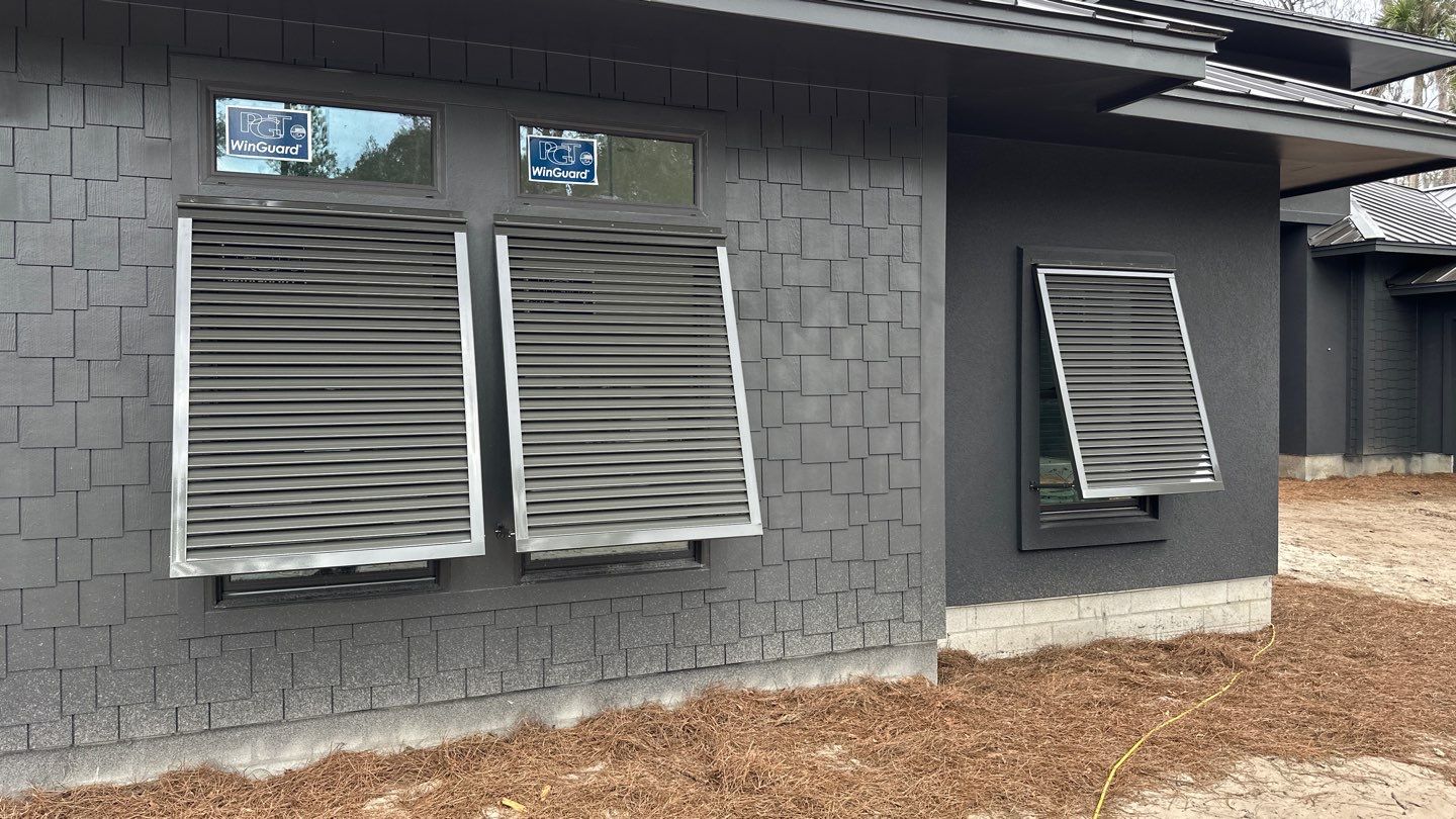 Bahama Shutters in Umbra Grey by Smart Guard Shutters