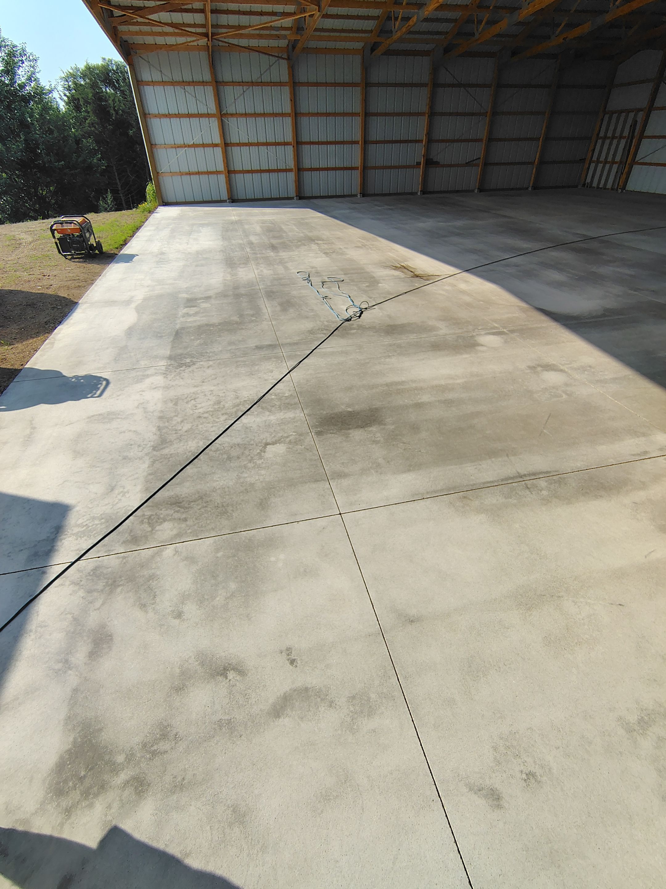 Durable Grey Speckled Epoxy Floor Coating for Yankton Shop by Select Painting, Coatings & Garage Cabinets