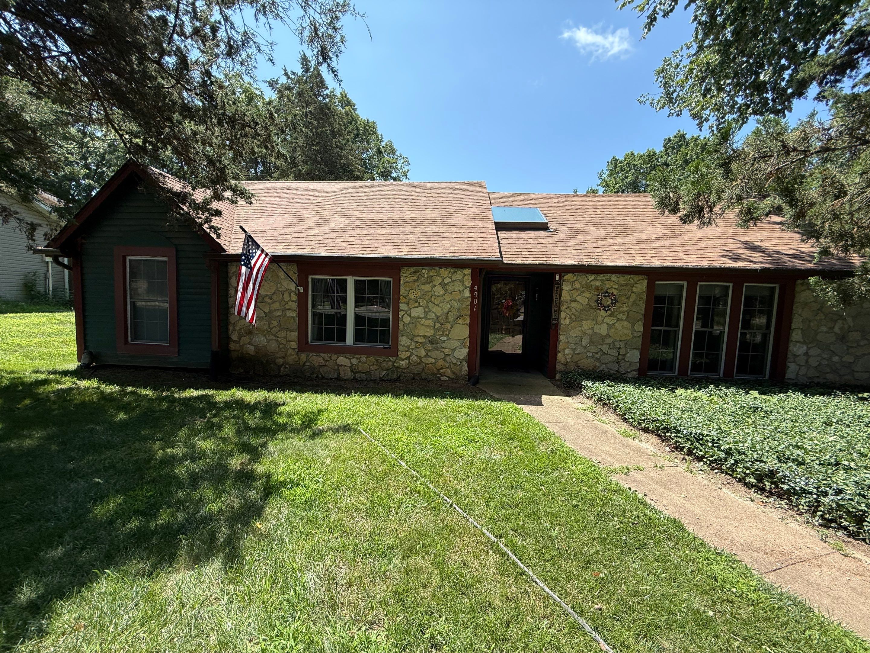 Wood siding refresh by Pezley Painting